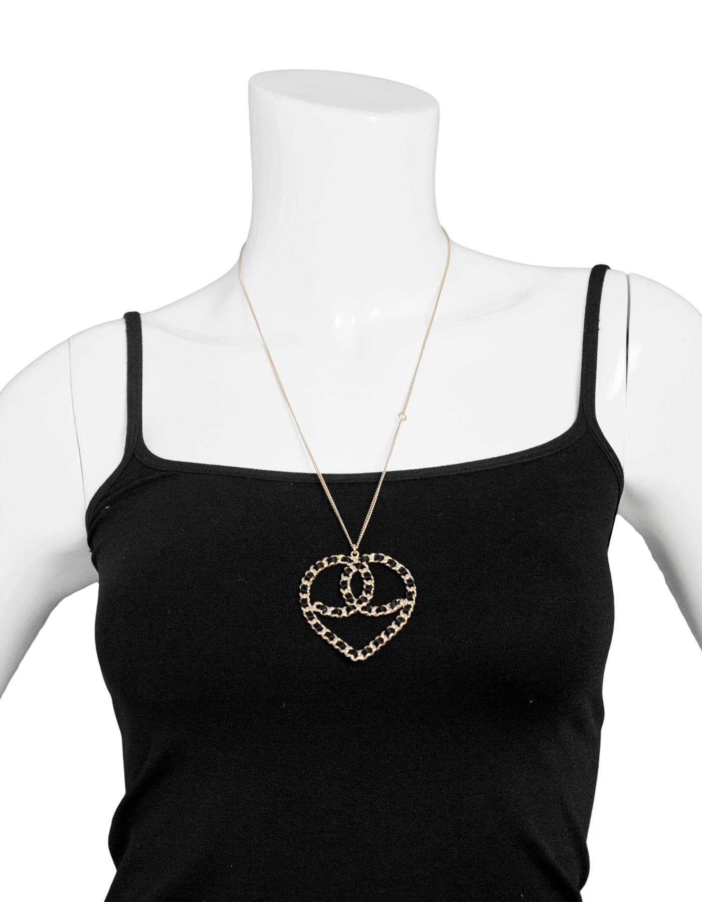 Chanel Black & Goldtone CC Heart Necklace
Features satin chain-link heart and adjustable length

Made In: Italy
Year of Production: 2009
Color: Light goldtone
Materials: Metal, satin
Closure: Lobster clasp
Stamp: Chanel 09 CC c Made In