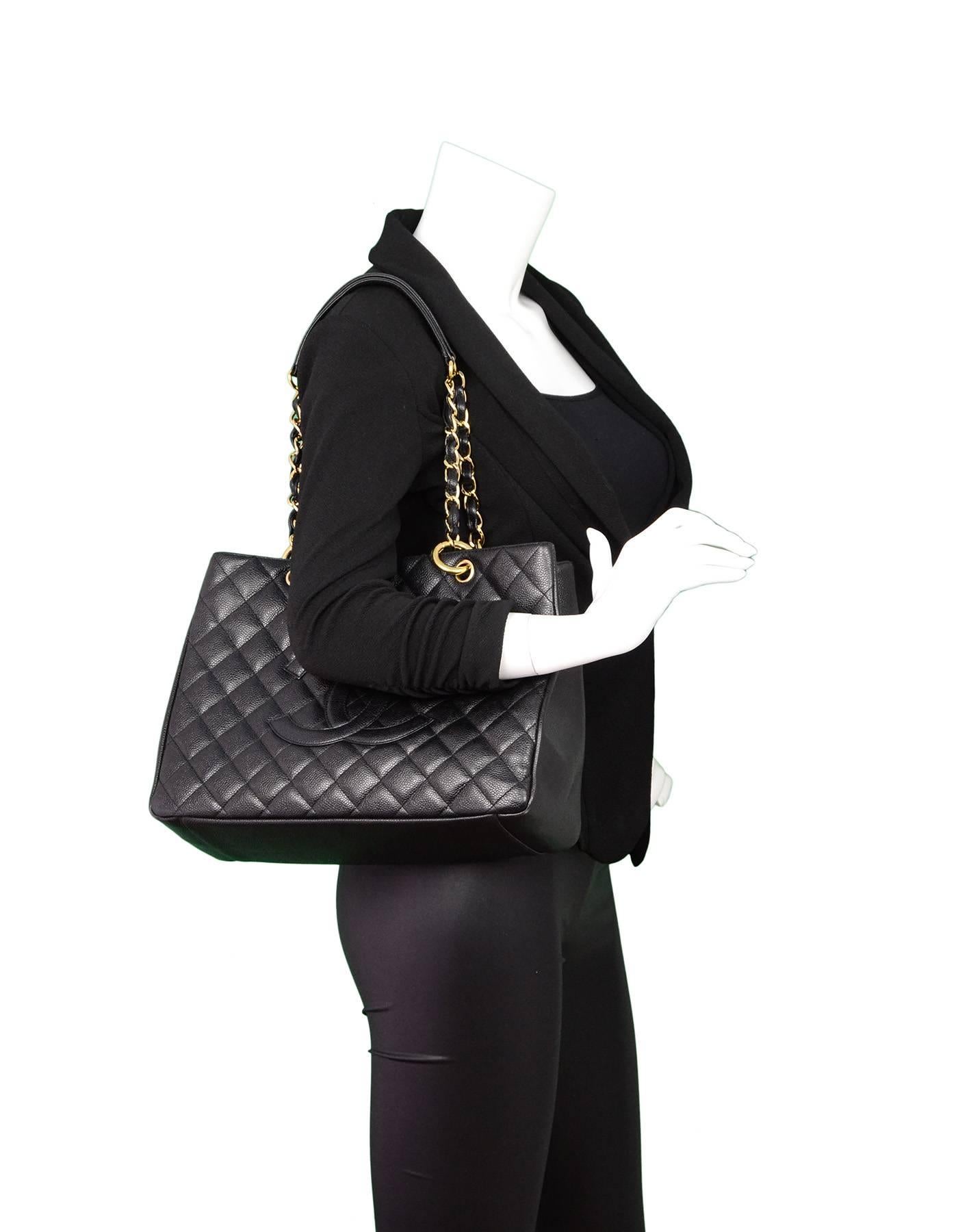 Chanel Black Caviar Grand Shopper Tote 
Features timeless CC at front - This is a *discontinued* style

Made In: Italy
Year of Production: 2004-2005
Color: Black
Hardware: Goldtone
Materials: Caviar leather
Lining: Black textile
Closure/Opening: