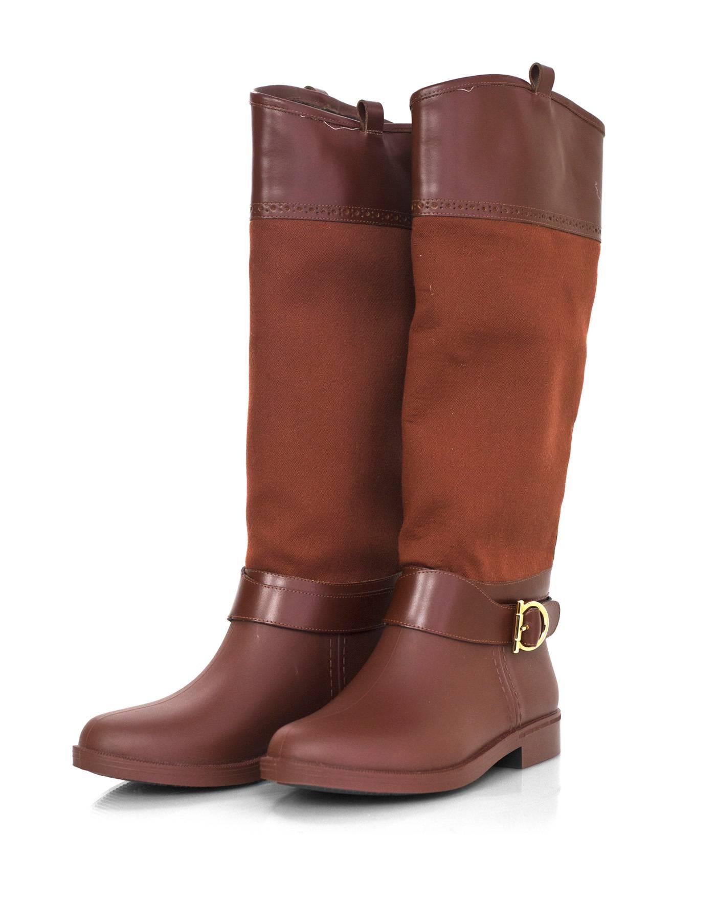 Salvatore Ferragamo Rust Riding Boots Sz 5
Features canvas shaft with leather trim and rubber feet and soles

Made In: Italy
Color: Ruse
Materials: Canvas, rubber, suede
Closure/Opening: Slide on
Sole Stamp: Salvatore Ferragamo Made in Italy