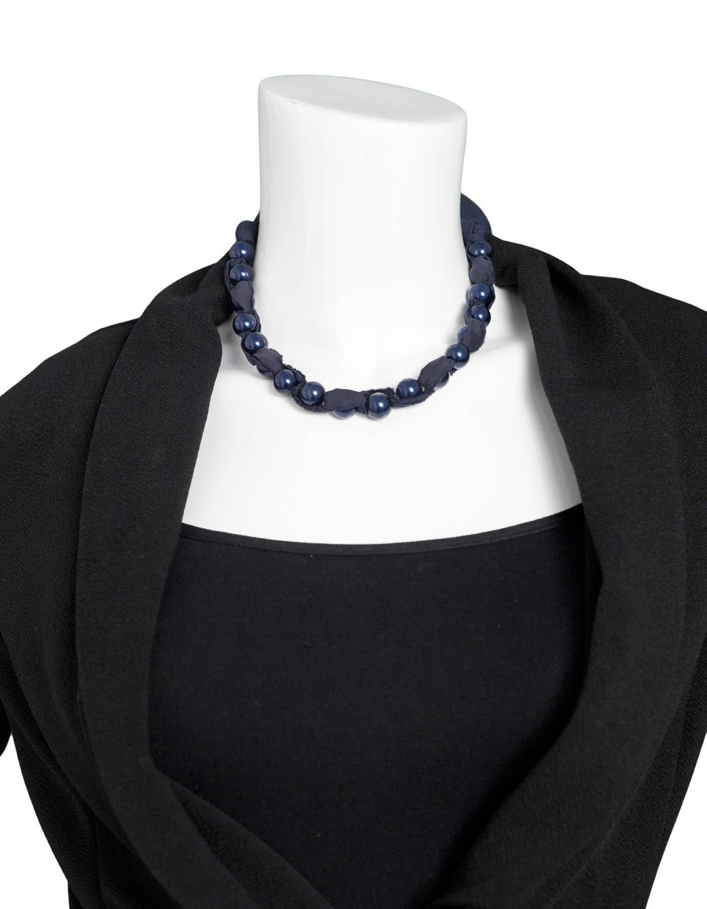 Lanvin Navy Beaded Ribbon Necklace

Color: Navy
Materials: Ribbon, beads
Closure/Opening: Tie closure
Overall Condition: Excellent pre-owned condition
Included: Lanvin dust bag

Measurements: 
Diameter: 27"