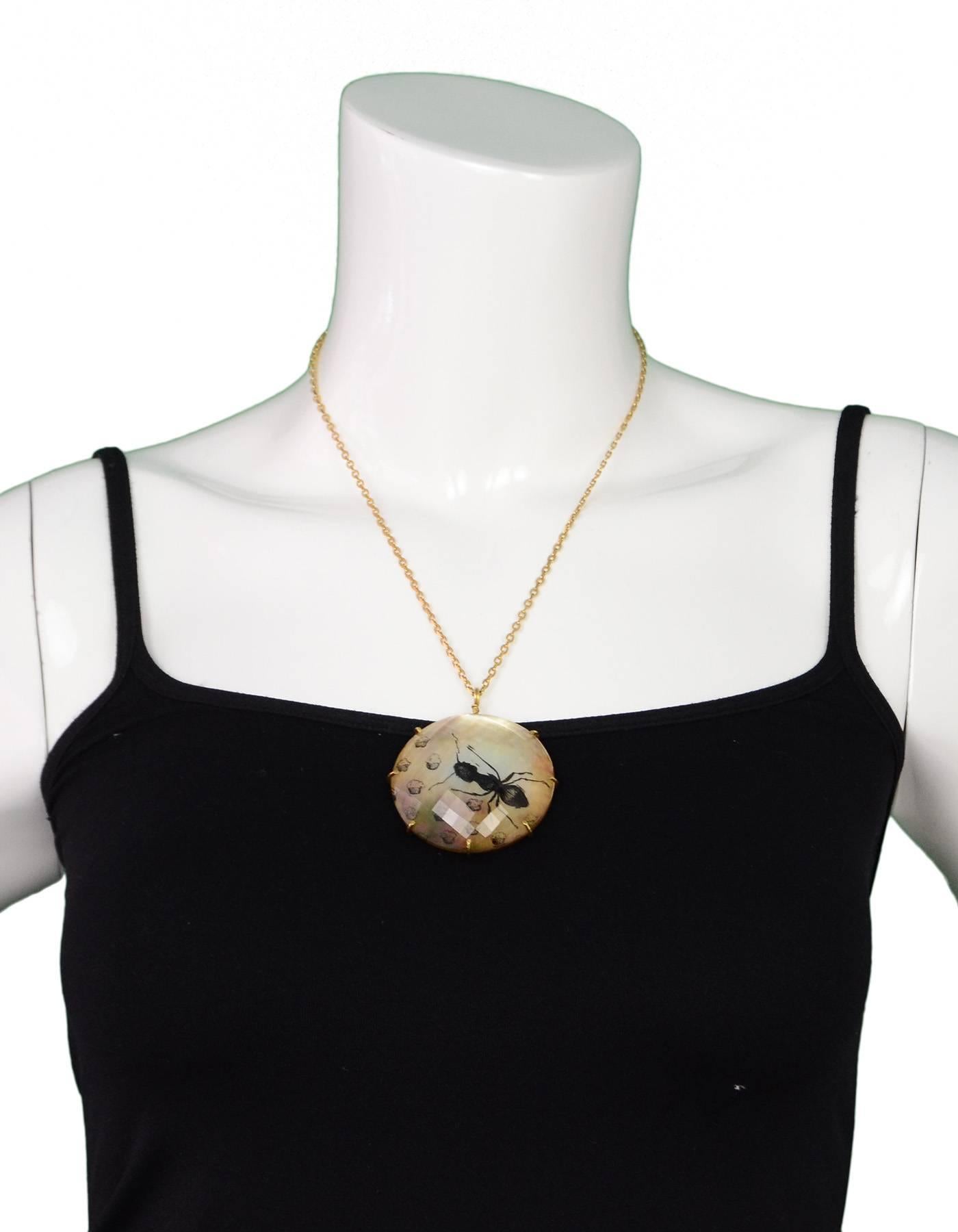 Anna Ruth Henriques 18k Mango Gold & Crystal Pendant Necklace 
This necklace is one-of-a-kind. Features ant and cupcake design inside of a faceted rock crystal set in 18k mango gold spider web.  Small diamond on signature spider charm at back