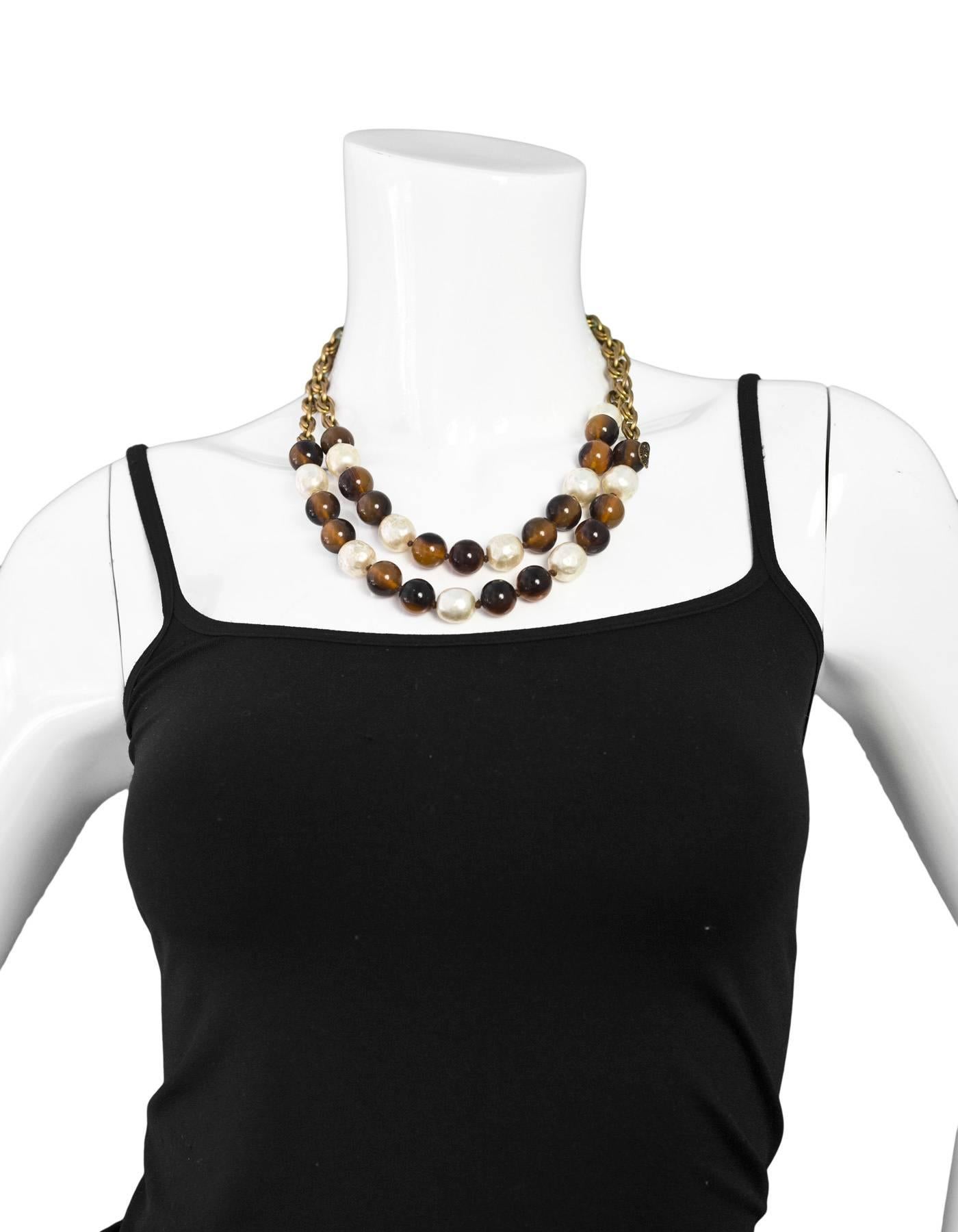 Chanel Vintage Beaded and Faux Pearl Necklace

Year of Production: 1985
Color: Goldtone, brown, ivory
Materials: Faux pearls, beads, metal
Stamp: CHANEL CC 1985
Closure: Jump ring closure
Overall Condition: Excellent with the exception of light