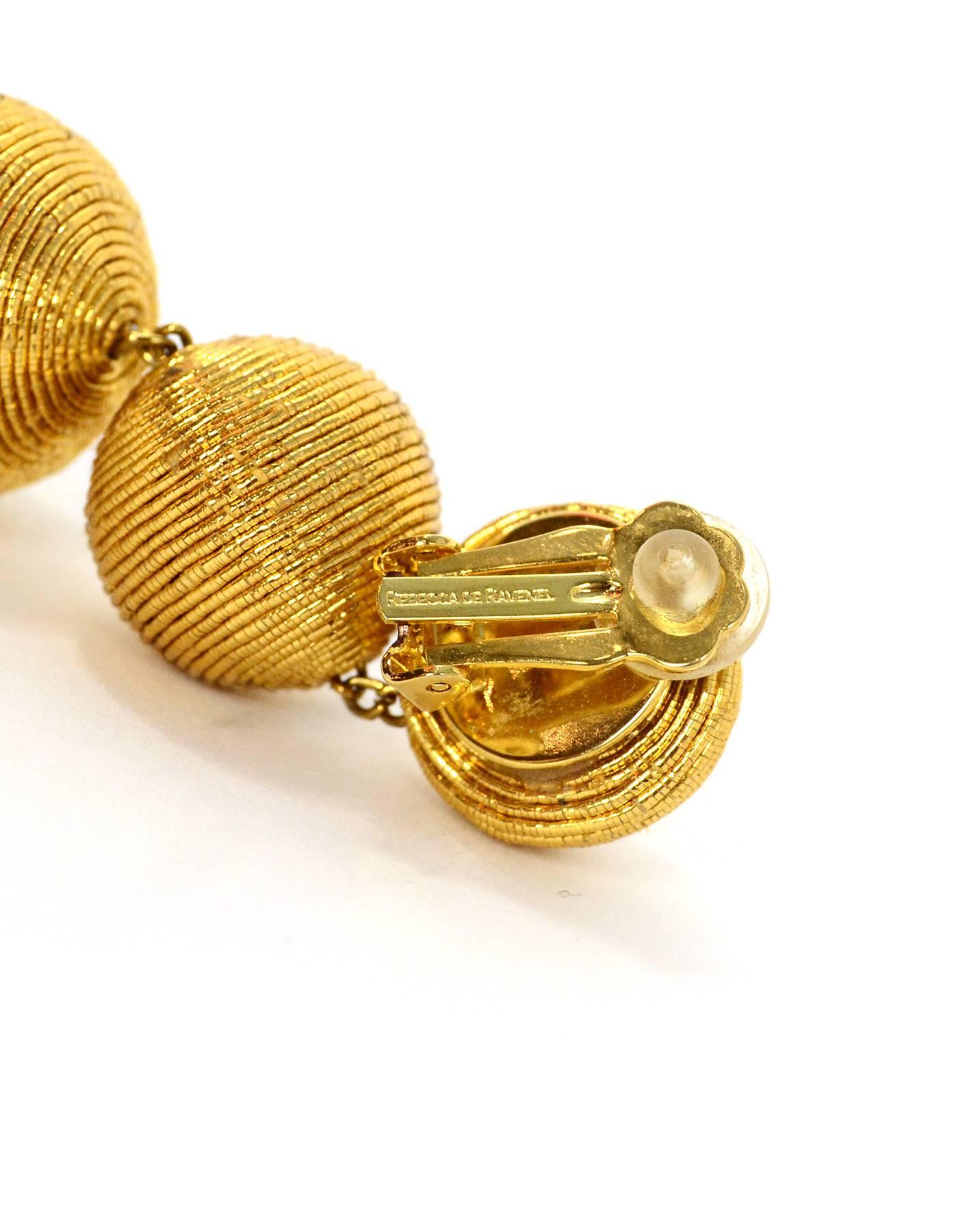 Rebecca De Ravenel Gold  Classic Silk Corded Ball Clip On Earrings

Color: Metallic gold
Materials: Metal and metallic cord
Closure: Clip on 
Stamp: Rebecca De Ravenel
Retail Price: $295 + tax
Overall Condition: Excellent pre-owned condition with