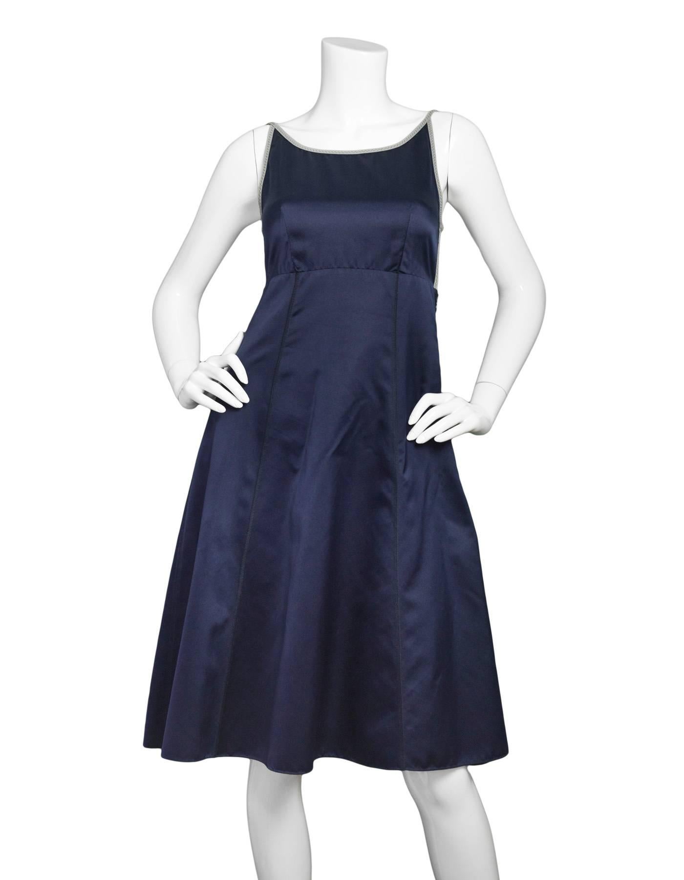 Prada Navy Silk Backless Spaghetti Strap Dress Sz IT38
Features tie detail at back

Made In: Italy
Color: Navy
Composition: 100% Silk
Lining: None
Closure/Opening: Hidden side zip closure, tie detail at back
Overall Condition: Excellent pre-owned