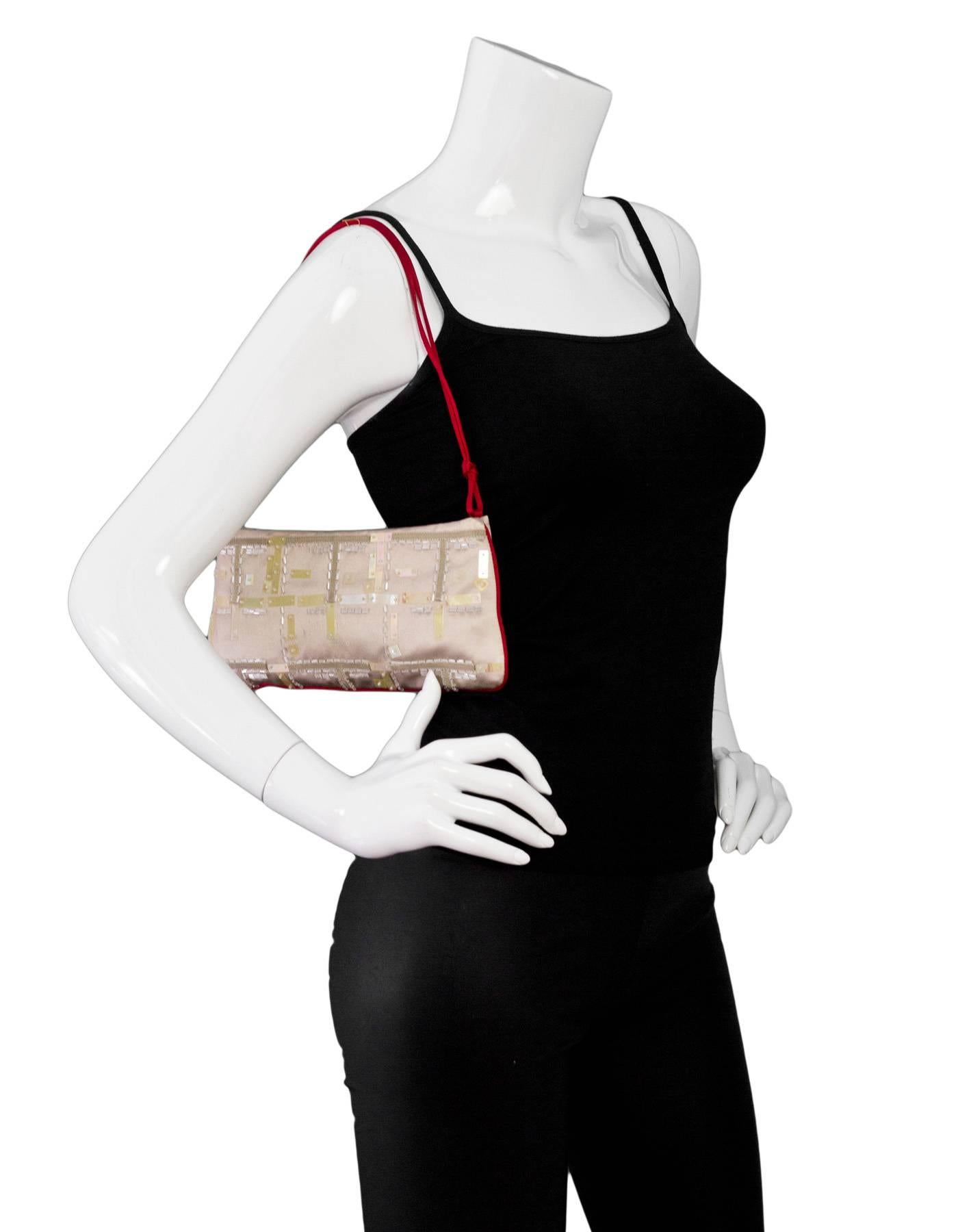Prada Champagne & Red Satin Beaded Pochette

Made In: Italy
Color: Champagne, red
Materials: Satin
Lining: Red satin
Closure/Opening: Magnetic closure
Exterior Pockets: None
Interior Pockets: One wall pocket
Overall Condition: Excellent