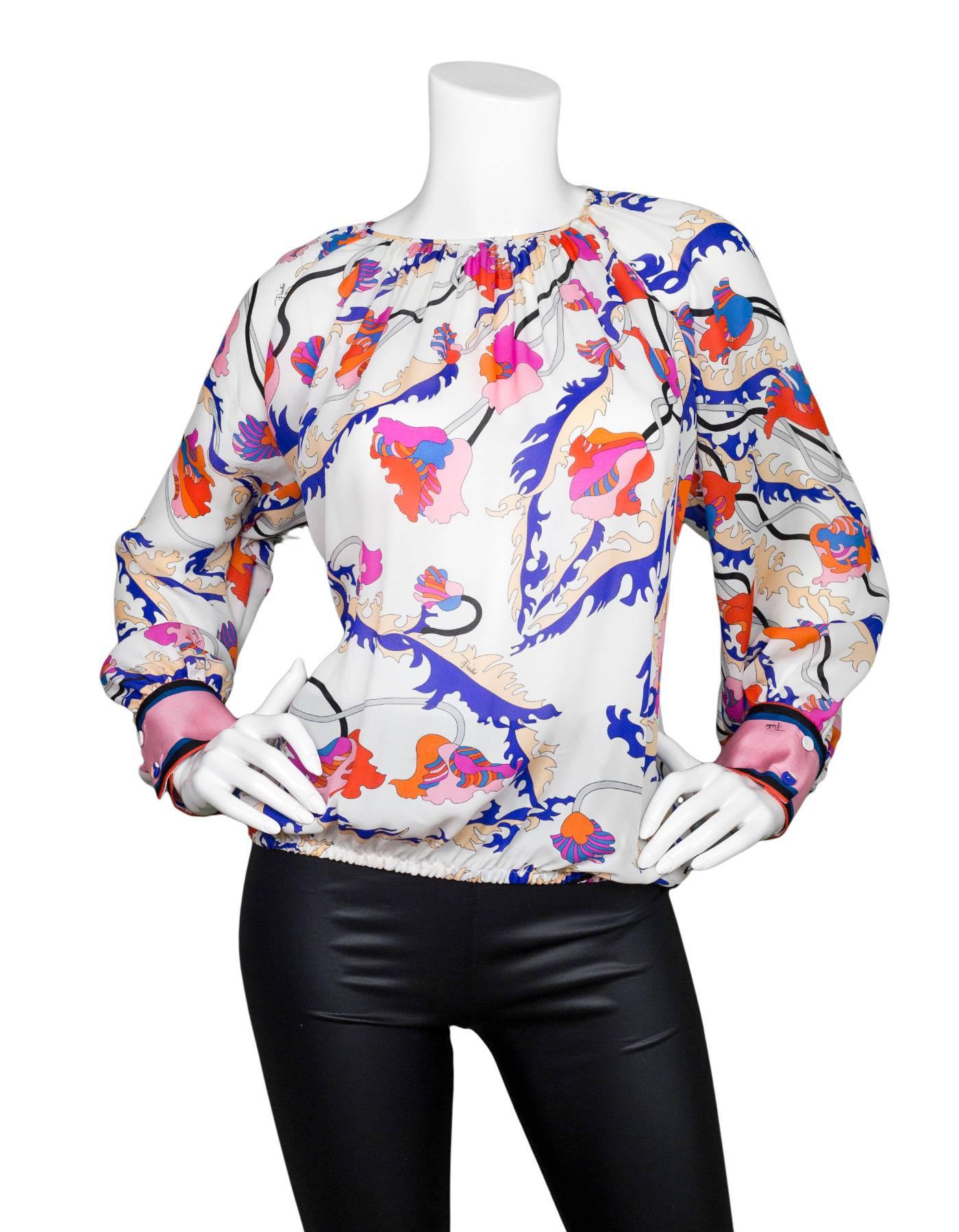 Emilio Pucci Multi-Colored Silk Blouse Sz US4

Made In: Italy
Color: Ivory, blue, pink, orange
Composition: 100% silk
Lining: None
Closure/Opening: Pull over with small button at neckline
Retail Price: $900 + tax
Overall Condition: Excellent