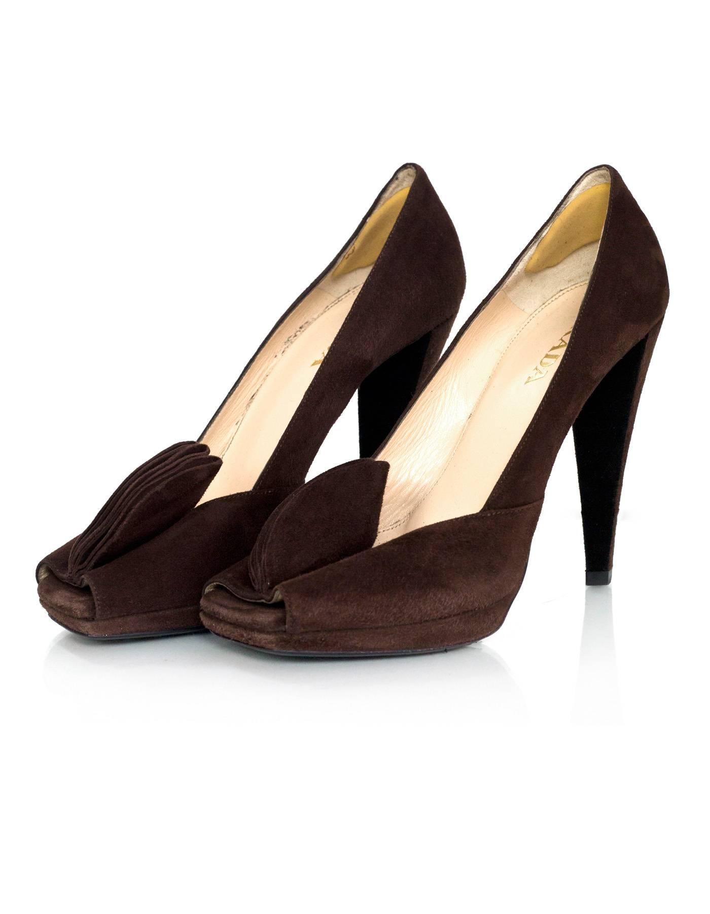 Prada Brown Suede Square Peep-Toe Pumps 
Features pedals at peep-toe

Made In: Italy
Color: Brown
Materials: Suede
Closure/Opening: Slip on
Sole Stamp: Prada 37 Made in Italy
Overall Condition: Excellent pre-owned condition with the exception of