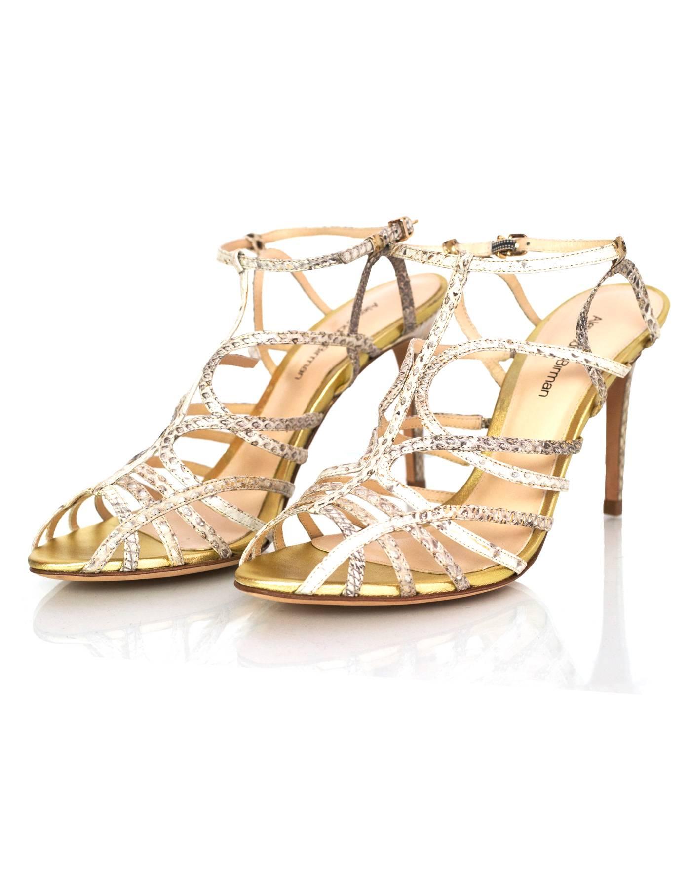 Alexandre Birman Gold and Beige Caged Sandals Sz 38

Made In: Brazil
Color: Beige, gold
Materials: Snakeskin
Sole Stamp: Alexandre Birman 38
Closure/opening: Buckle closure at ankle
Overall Condition: Excellent pre-owned condition - no signs of