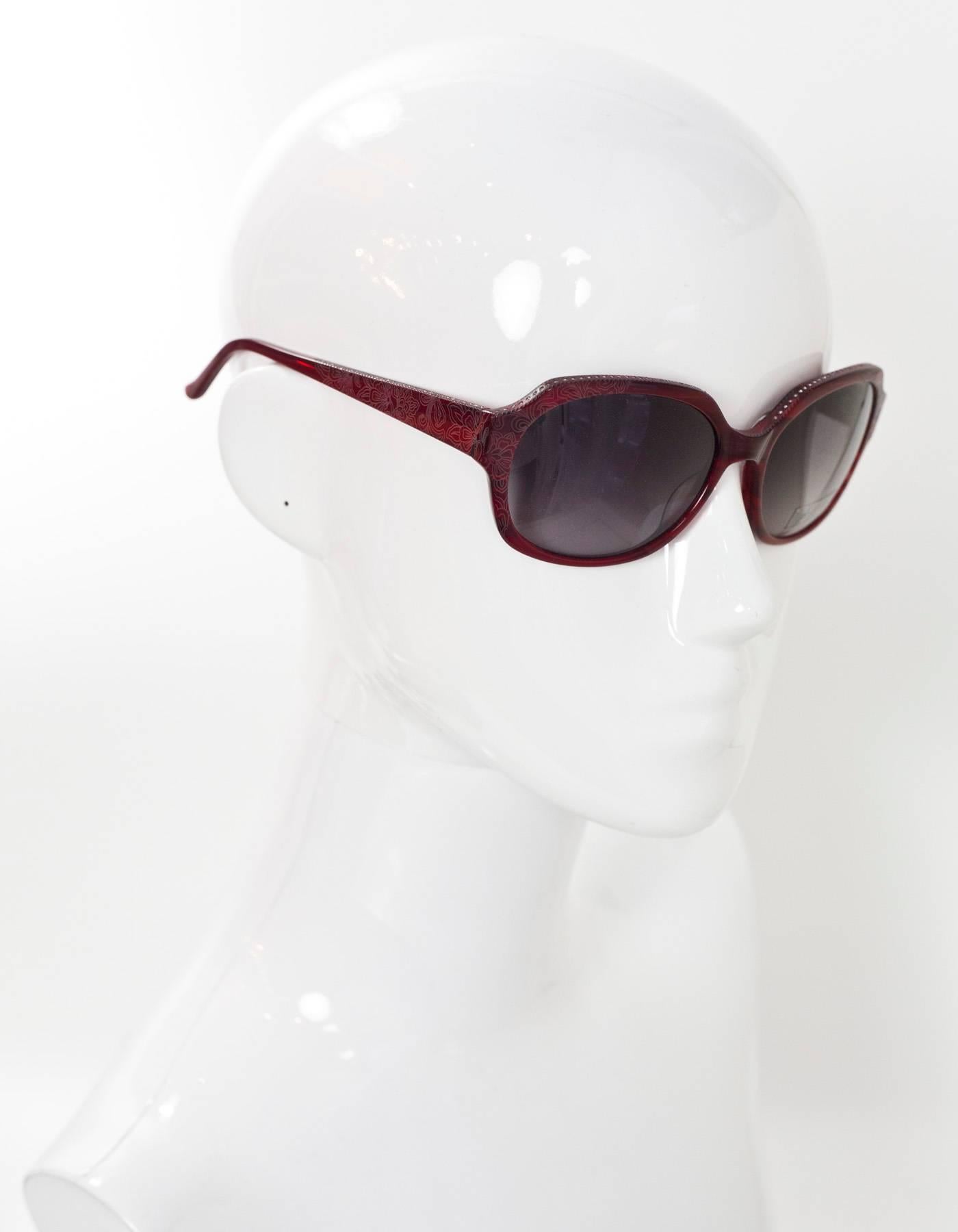 Judith Leiber Red Swarovski Crystal Sunglasses
Features crystals at top of frame and arms and floral laser-etched design

Made In: Japan
Color: Red
Materials: Resin, crystal
Retail Price: $420 + tax
Overall Condition: Excellent pre-owned