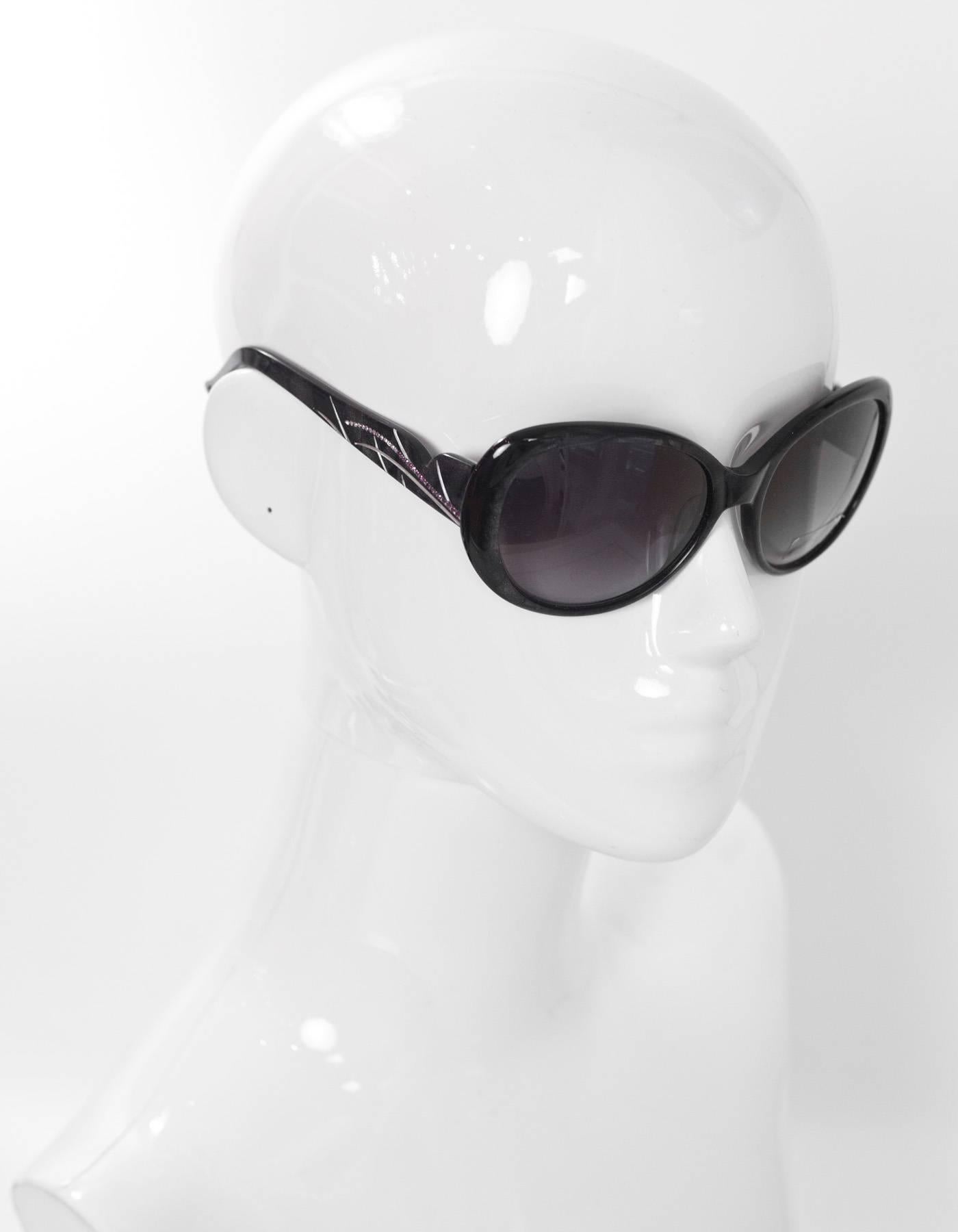 Judith Leiber Black Glitter & Purple Crystal Sunglasses

Features pave crystal flower at arm

Made In: Japan
Color: Black, purple
Materials: Resin, crystal
Retail Price: $440 + tax
Overall Condition: Excellent pre-owned condition
Includes: Judith