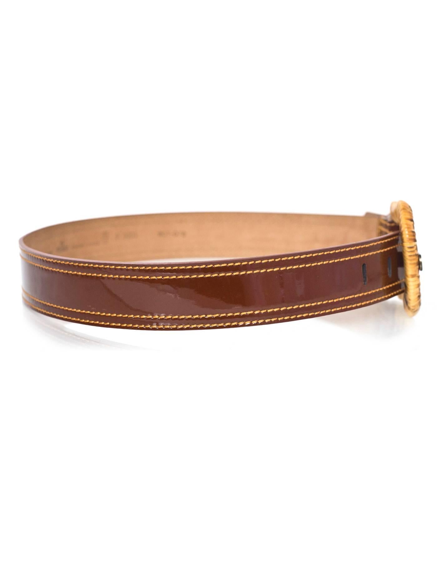 Fendi Brown Patent & Wicker Belt 
Features wicker wrapped belt buckle 

Made In: Italy
Color: Brown and tan
Hardware: Wicker and bronze
Materials: Patent leather and wicker
Closure/Opening: Buckle and notch closure
Stamp: 8C0303 WCT-078
Overall