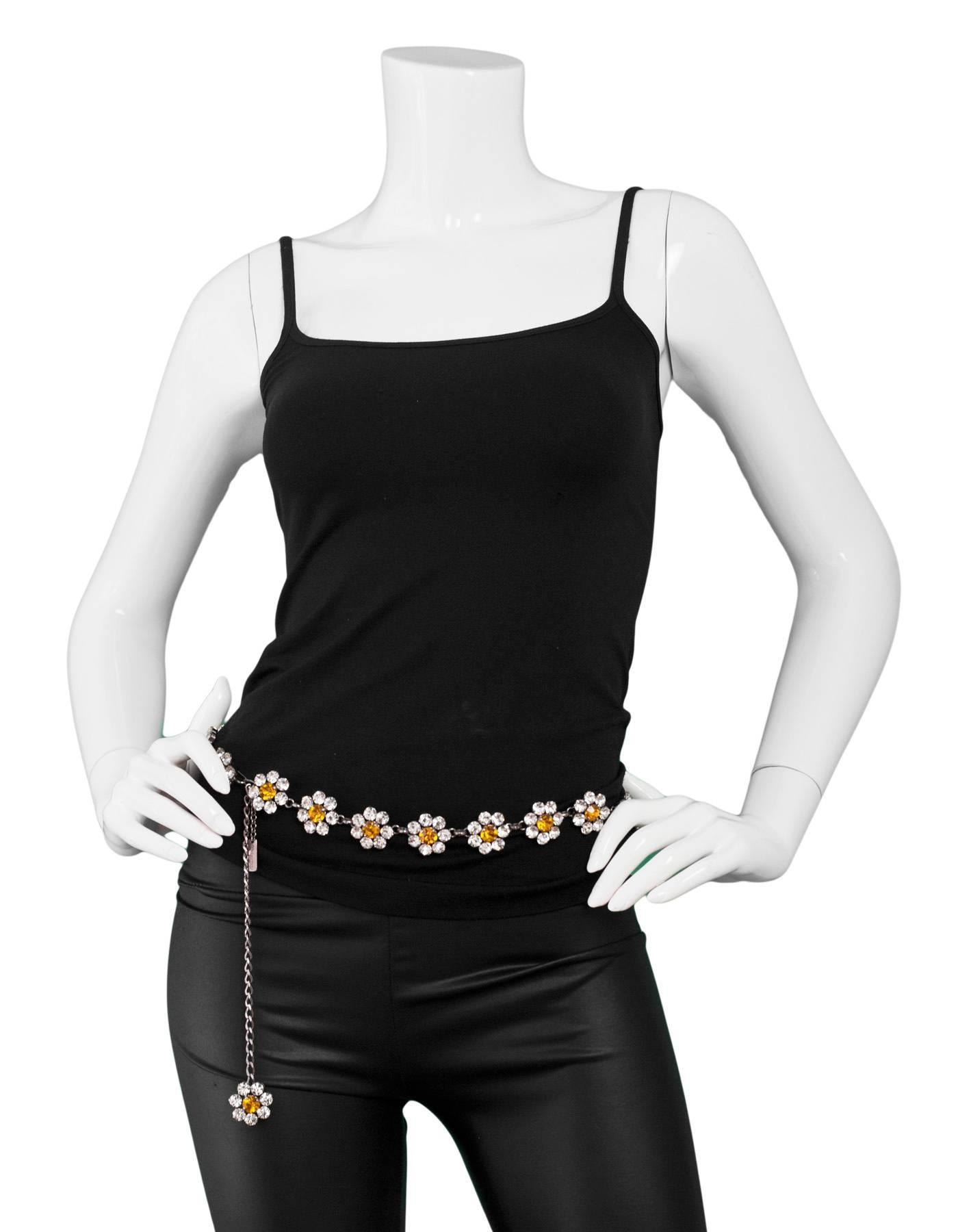 Dolce & Gabbana Crystal Flower Belt

Made In: Italy
Color: White, yellow
Hardware: Crystals, metal
Materials: Metal, crystal
Closure/Opening: Velcro closure
Overall Condition: Excellent - missing one crytal
Includes: Black dust