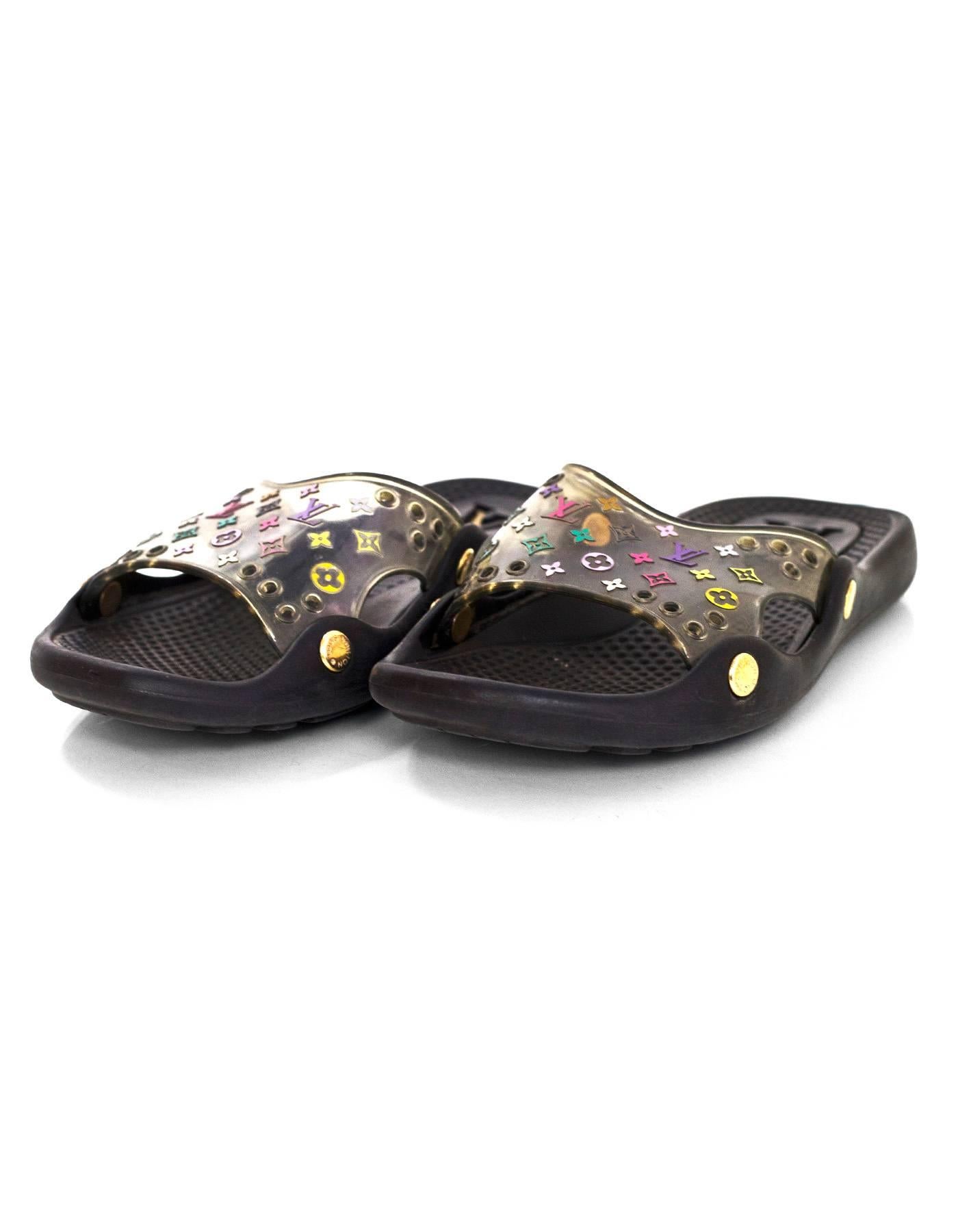 Louis Vuitton Black & Multi-Colored Monogram Slide Sandals 

Made In: Italy
Color: Black and multi-colored
Materials: Plastic
Closure/Opening: Slide on
Sole Stamp: LV Made in Italy 35
Overall Condition: Very good pre-owned condition with the