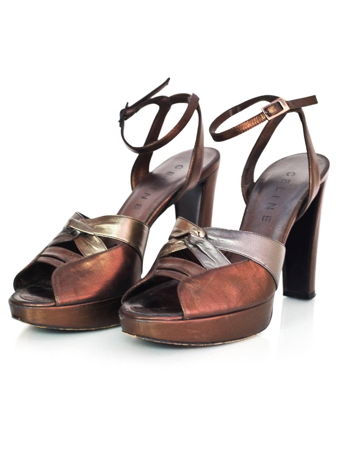 Celine Bronze & Pewter Leather Platform Pumps Sz 38

Made In: Italy
Color: Brown, pewter
Materials: Leather
Closure/Opening: Buckle closure at ankle
Sole Stamp: Celine 38 Made in Italy
Overall Condition: Excellent pre-owned condition with very