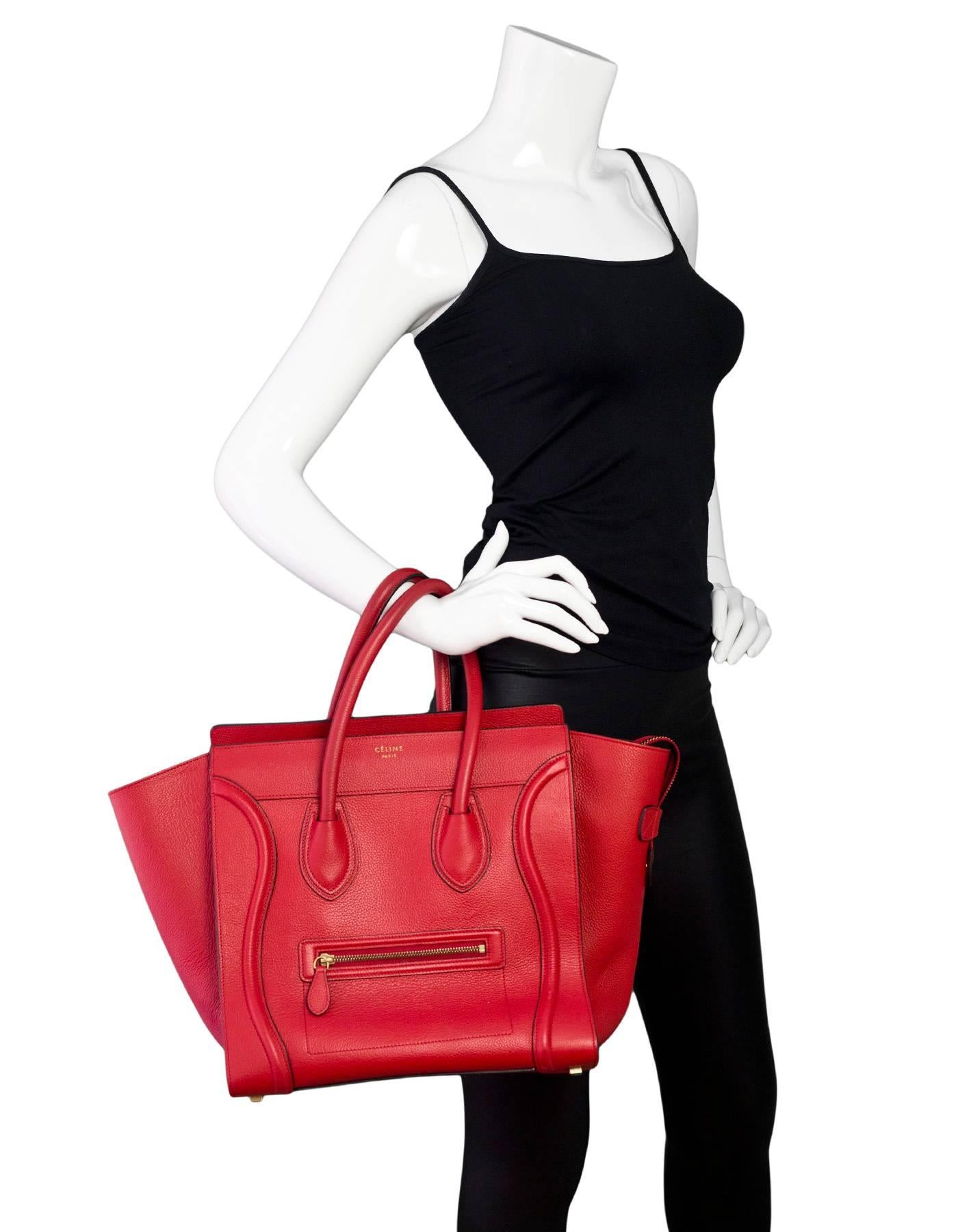 Celine Red Drummed Leather Mini Luggage Tote 

Made In: Italy
Color: Red
Hardware: Goldtone
Materials: Drummed leather
Lining: Red suede
Closure/Opening: Zip across top
Exterior Pockets: One zipper pocket
Interior Pockets: One zipper pocket, one