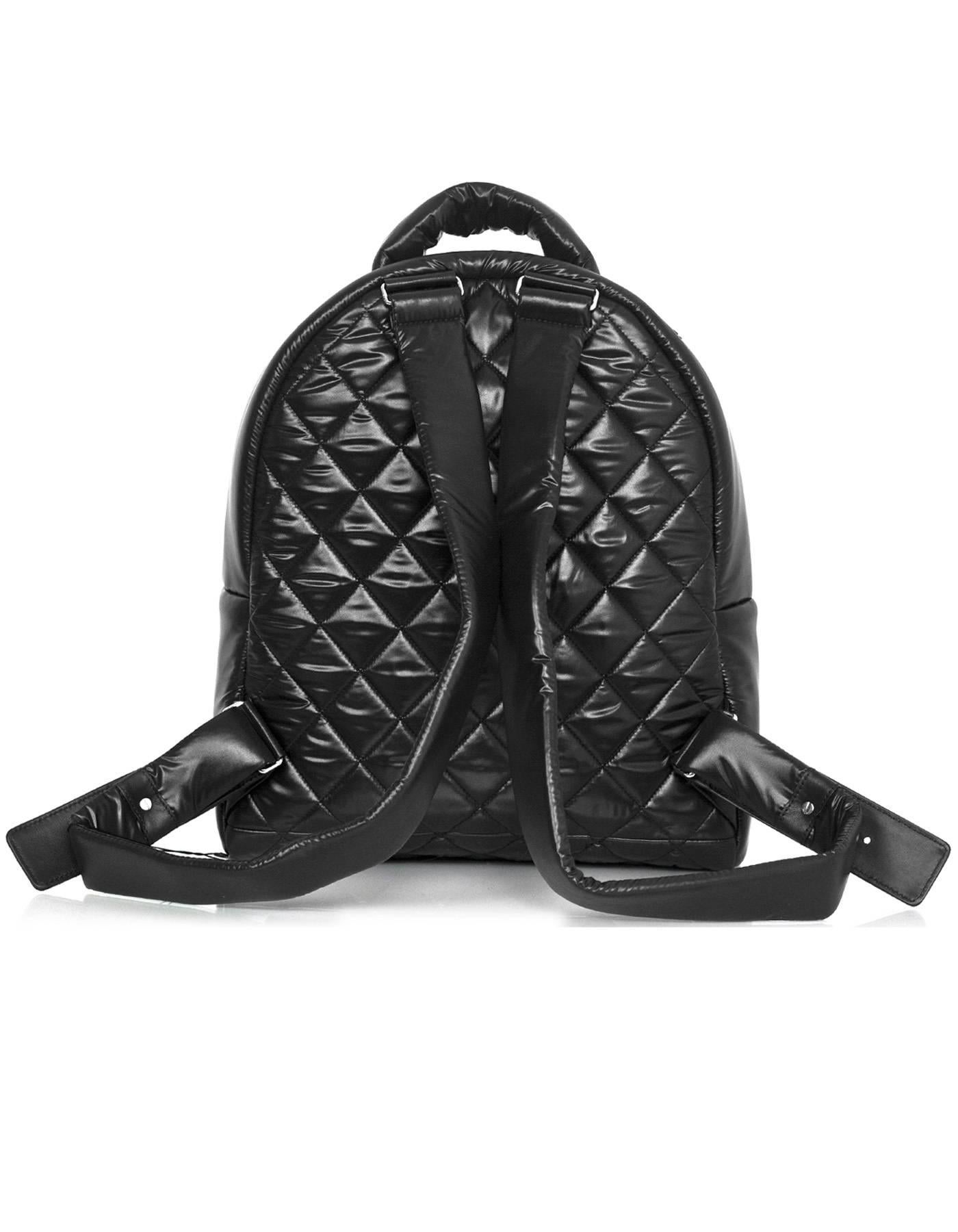 Chanel NEW Black Quilted Nylon Coco Cocoon Backpack 
Features leather logo on front zipper pocket

Made In: Italy
Year of Production: 2017
Color: Black
Hardware: Silvertone
Materials: Nylon
Lining: Burgundy nylon
Closure/Opening: Zip around