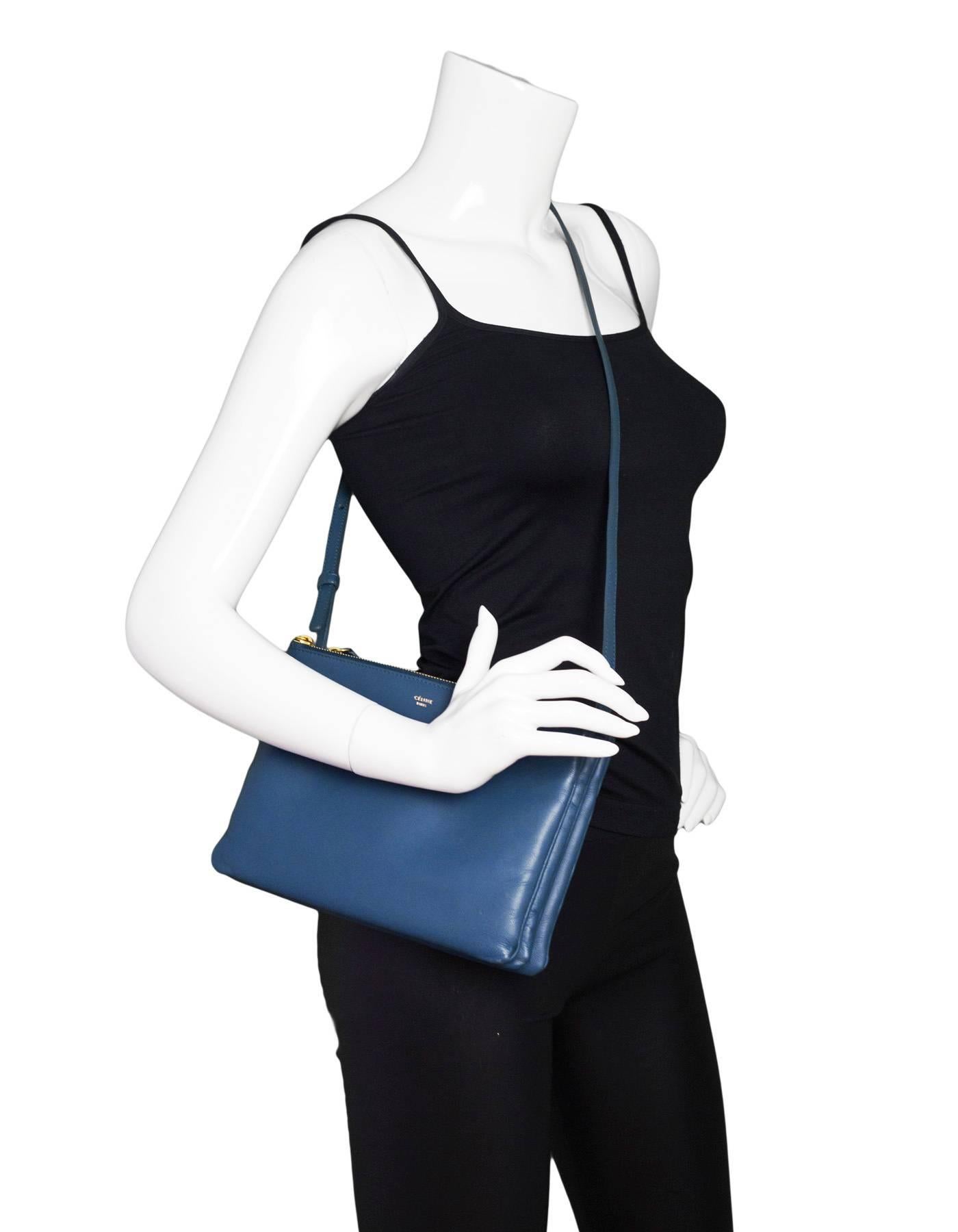 Celine Blue Leather Large Trio Crossbody Bag

Three zip pouches that snap together. Can wear all three together, or only one as a crossbody or clutch bag. You can be creative and mix and max with other Trio pouches for a unique look.

Made In: