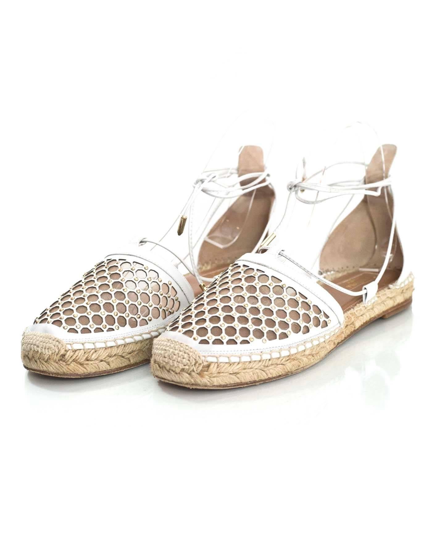 Aquazzura White Leather Blondie Espadrilles Sz 38.5

Made In: Spain
Color: Black
Materials: Leather, mesh
Closure/Opening: Lace tie closure
Sole Stamp: Aquazzura Firenze Vero Cuoio Made In Spain 38.5
Overall Condition: Excellent pre-owned condition