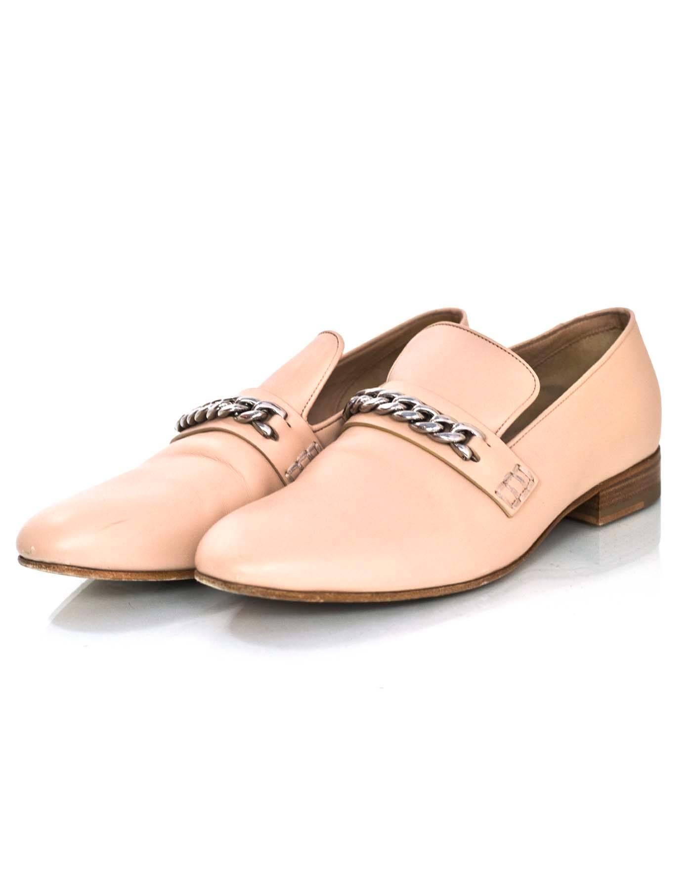 Celine Phoebe Philo Collection Nude Loafers Sz 39.5

Made In: Italy
Color: Nude
Materials: Lleather, metal
Closure/Opening: Slide on
Sole Stamp: Celine Paris 39.5 Made in Italy
Retail Price: $895 + tax
Overall Condition: Excellent pre-owned