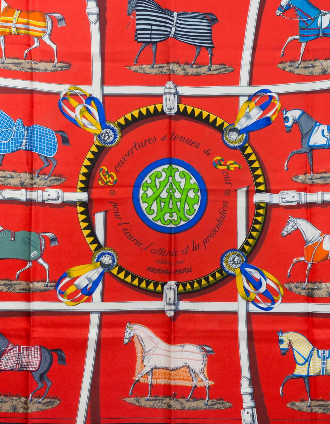 Hermes Covertures et Tenues de Jour Silk 90cm Scarf
Features race horse design

Made In: France
Color: Red, multi
Composition: 100% Silk
Retail Price: $395 + tax
Overall Condition: Excellent pre-owned condition

Measurements:
Length: 36"
Width:
