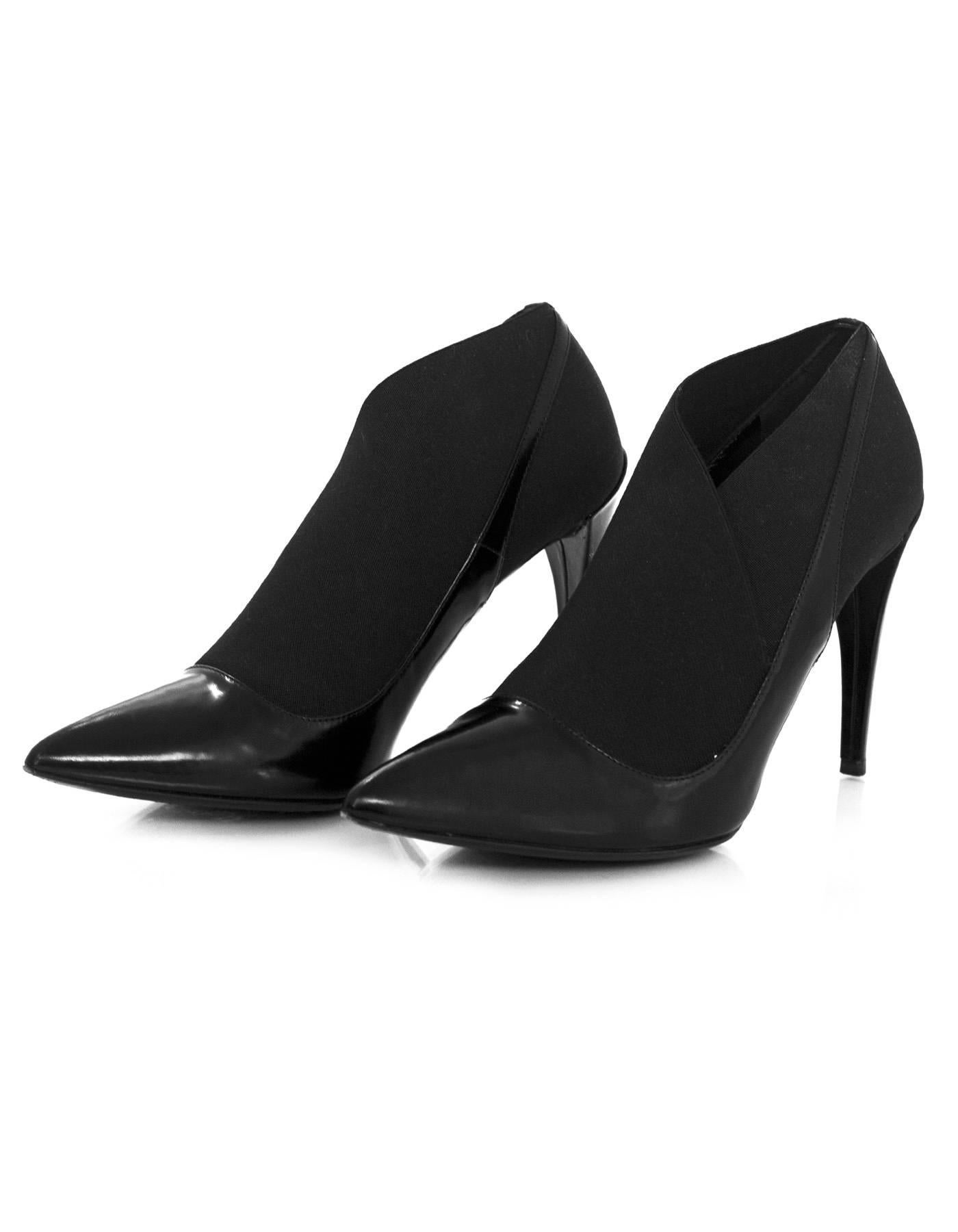 Christian Dior Black Leather & Elastic Pumps 

Made In: Italy
Color: Black
Materials: Leather and elastic
Closure/Opening: Slip on
Sole Stamp: Made in Italy 37 1/2 CD
Overall Condition: Excellent pre-owned condition with the exception of some wear