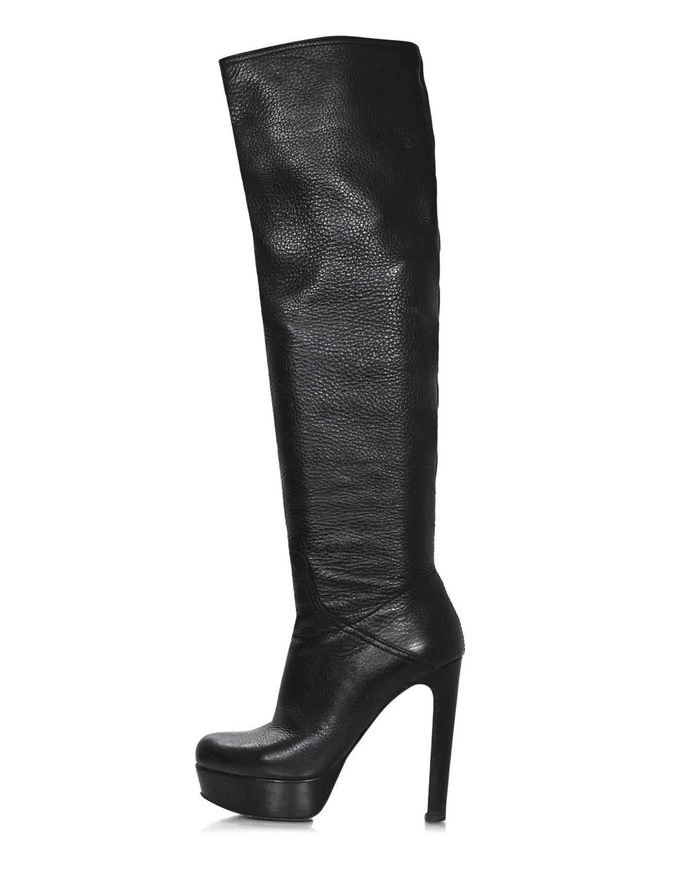 Miu Miu Black Leather Over The Knee Boots Sz 38
Features stirrup detail that can be removed

Made In: Italy
Color: Black
Materials: Leather, metal
Closure/Opening: Slide on with partial side zipper
Sole Stamp: Miu Miu Made Italy 38
Overall