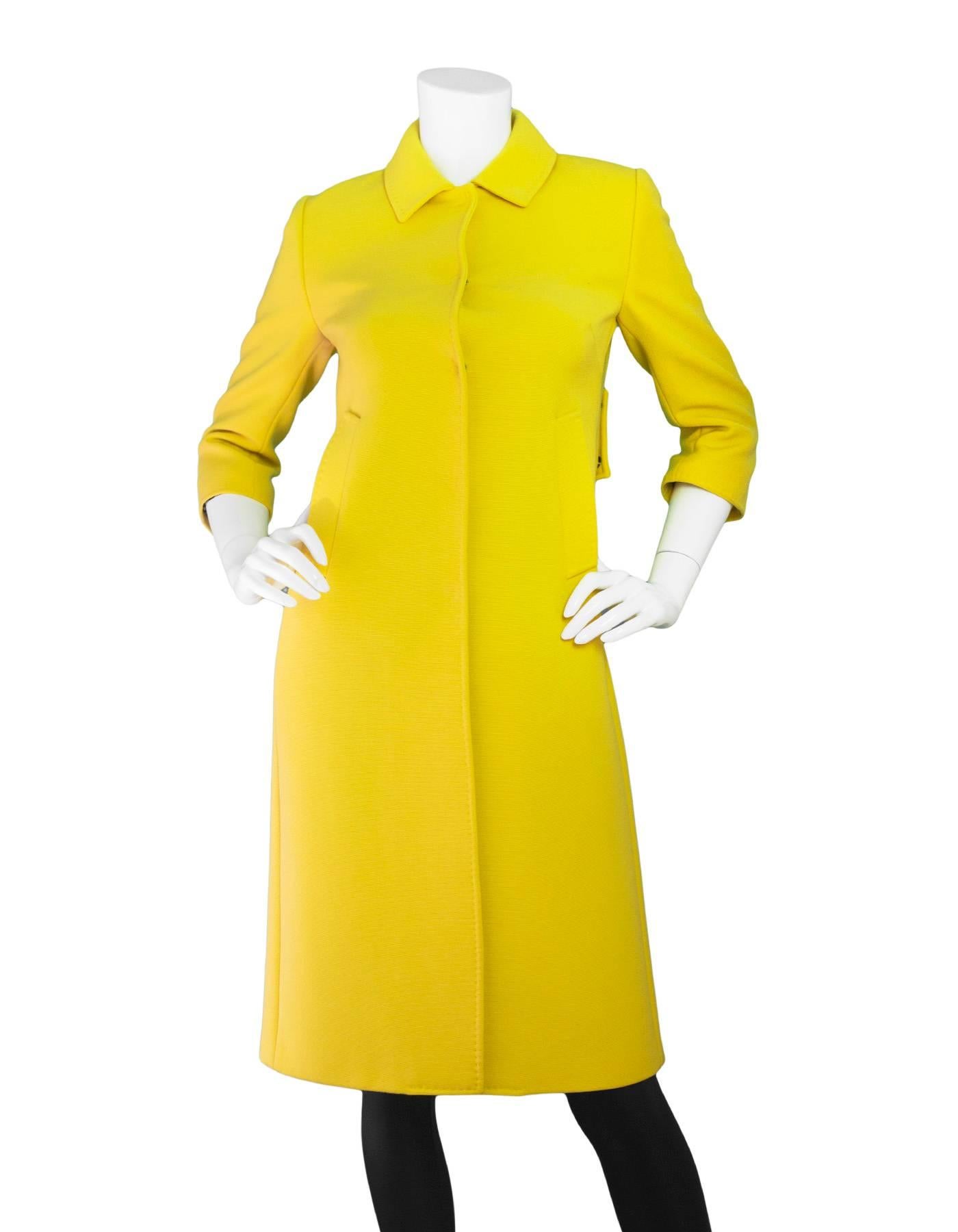 Dolce & Gabbana Yellow Wool Button Up Coat Sz IT40

Made In: Italy
Color: Yellow
Composition: 98% wool, 2% nylon
Lining: Leopard textile
Closure/Opening: Front double snap button closure
Overall Condition: Excellent pre-owned condition

Marked