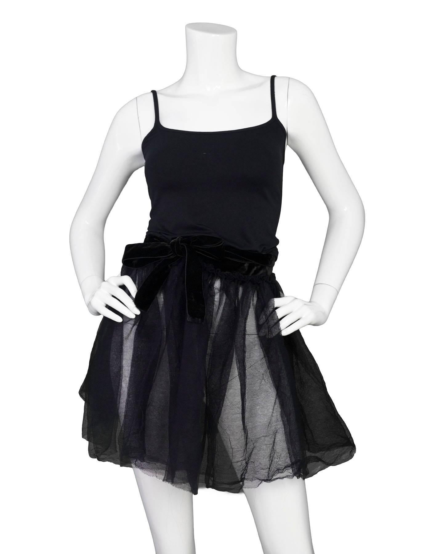 Lanvin Black Tulle Wrap Skirt

Color: Black
Composition: Not listed, feels like nylon blend
Closure/Opening: Velvet waistband with tie closure
Overall Condition: Excellent pre-owned condition

Measurements:
Waist: 30