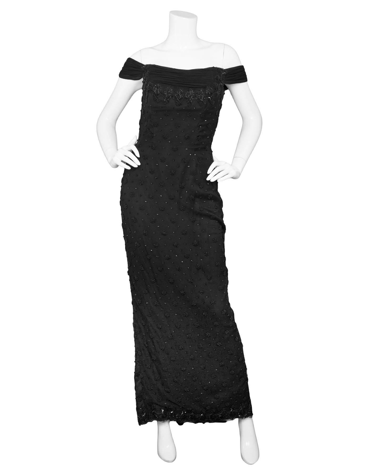 Vicky Tiel Black Beaded Gown Sz 6
Features boning in bodice with beading and sequins throughout

Made In: France
Color: Black
Composition: Rayon, nylon blend
Lining: Black textile
Closure/Opening: Back zip closure
Retail Price: $6,000 + tax
Overall