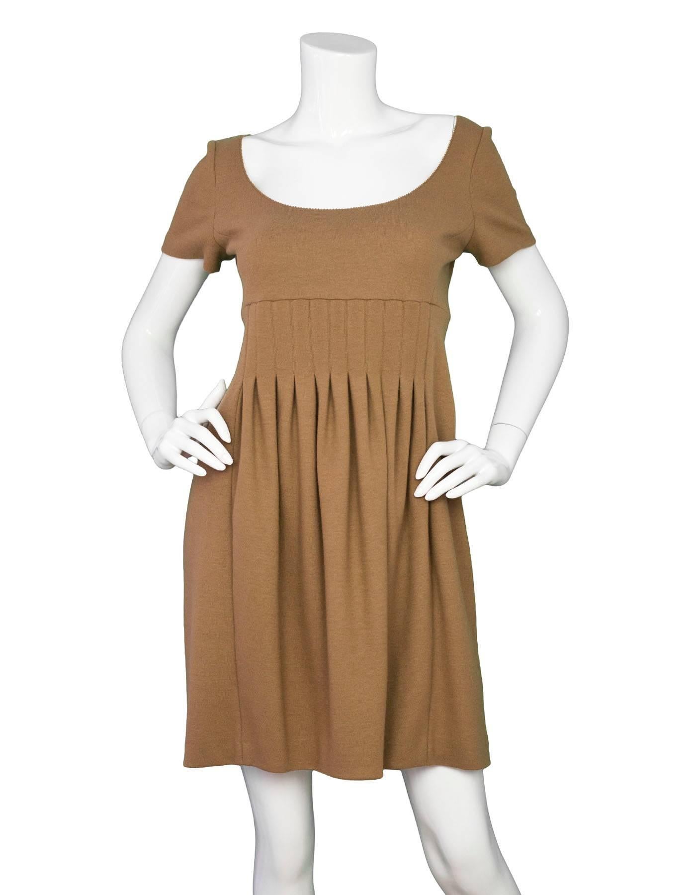 Fendi Brown Wool Short Sleeve Pleated Dress Sz IT40

Made In: Italy
Color: Brown
Composition: 100% Wool
Lining: Brown textile
Closure/Opening: Back zip closure
Overall Condition: Excellent pre-owned condition

Marked Size: IT40 / US 2,4
Bust: