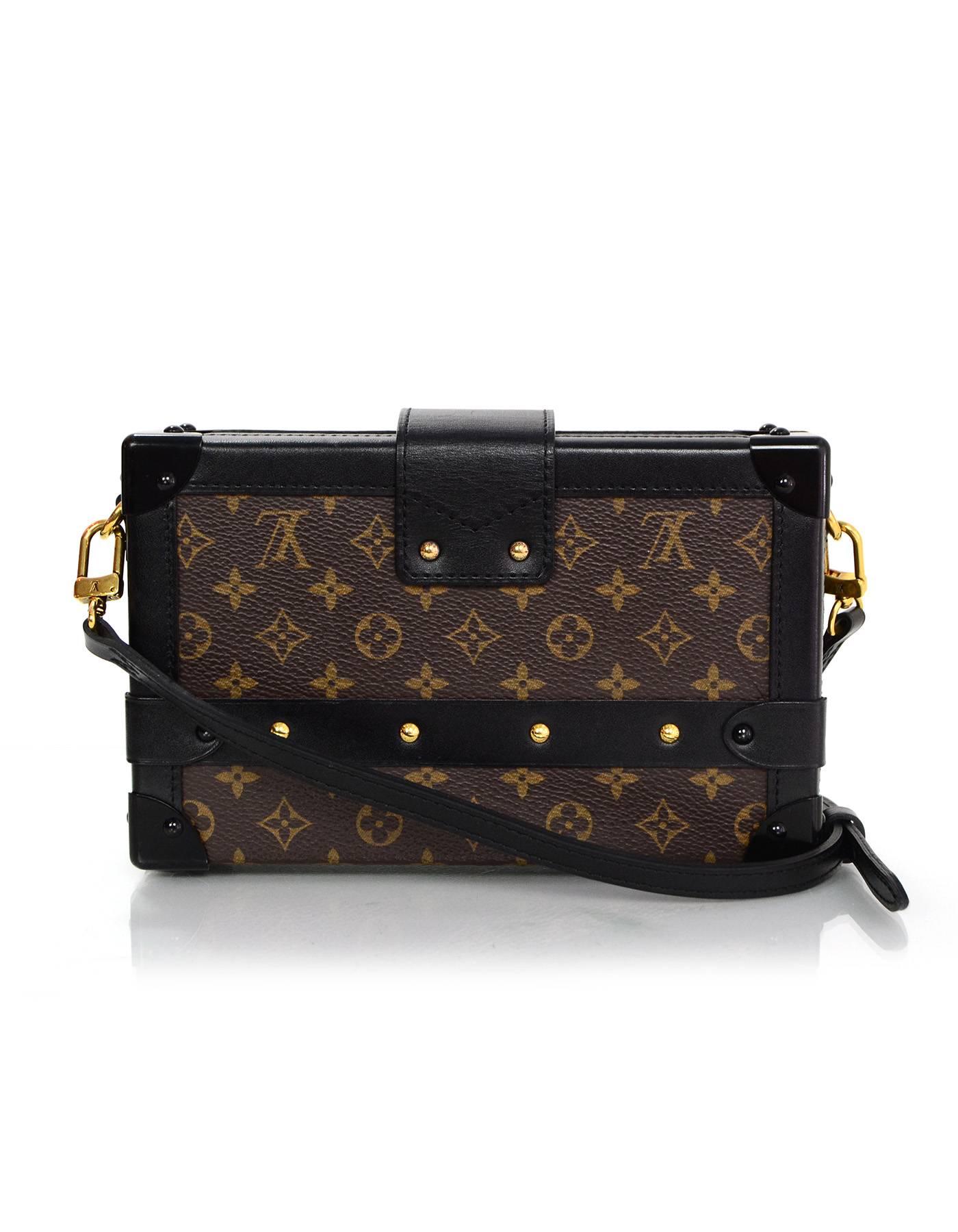 Louis Vuitton Monogram Petite Malle Trunk Crossbody Bag
Features optional and adjustable shoulder/crossbody strap

Made In: France
Year of Production: 2014
Color: Brown, black and red
Hardware: Goldtone
Materials: Coated canvas and leather
Lining: