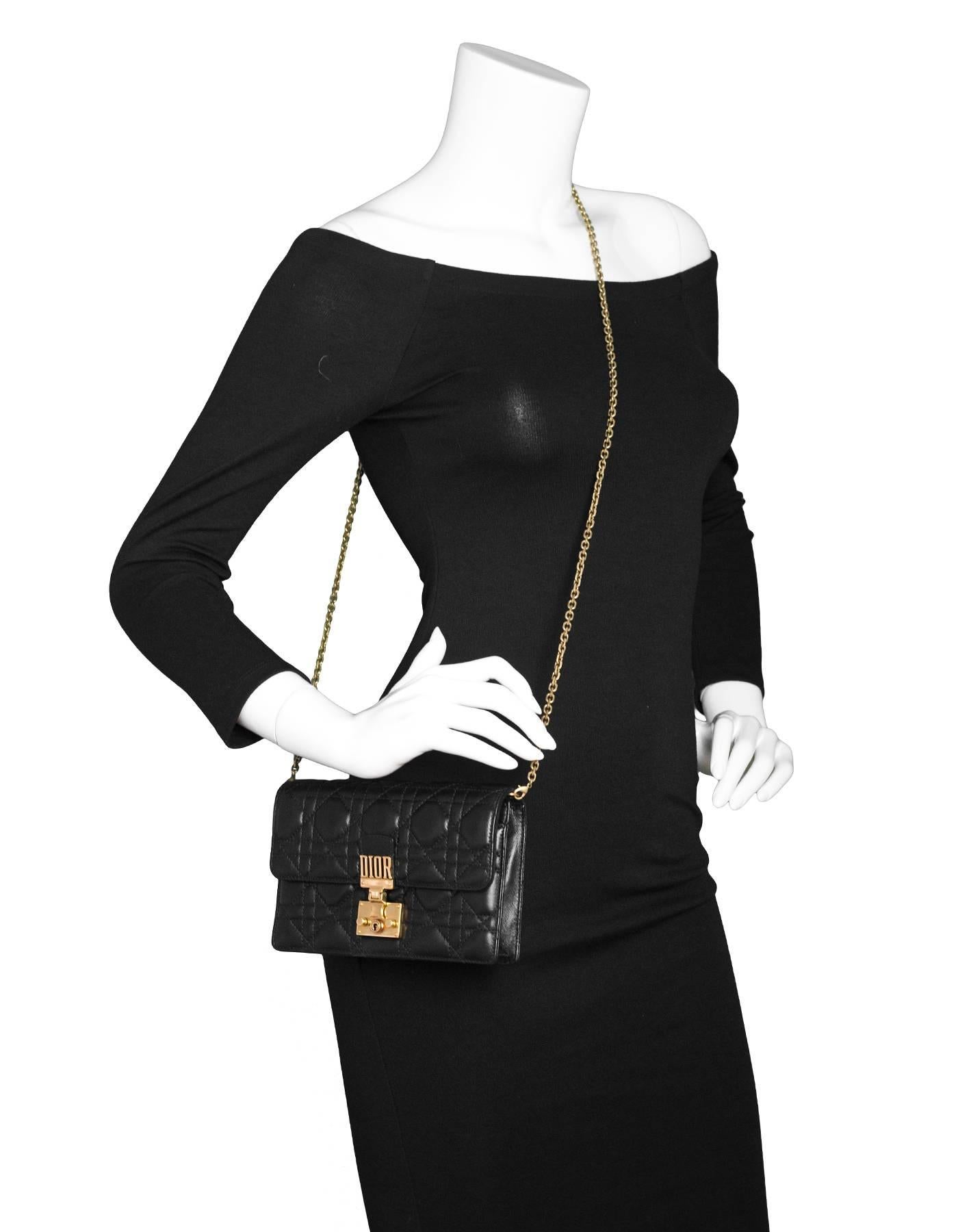 Christian Dior Black Leather Dioraddict Wallet On Chain Crossbody
Chain strap can be removed

Made In: Italy
Color: Black
Hardware: Goldtone
Materials: Leather, metal
Lining: Black suede
Closure/Opening: Flap top with oush lock closure
Exterior