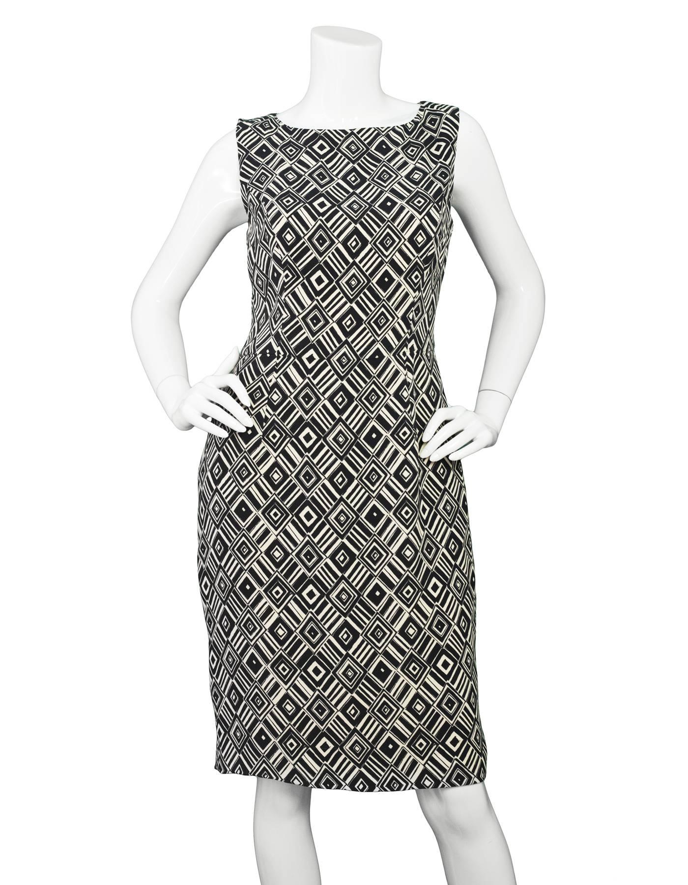 Christian Dior Black & Ivory Silk Sheath Dress Sz 8

Made In: Italy
Color: Black, ivory
Composition: 100% Silk
Lining: Nude silk
Closure/Opening: Zip closure at back
Exterior Pockets: None
Interior Pockets: None
Overall Condition: Excellent