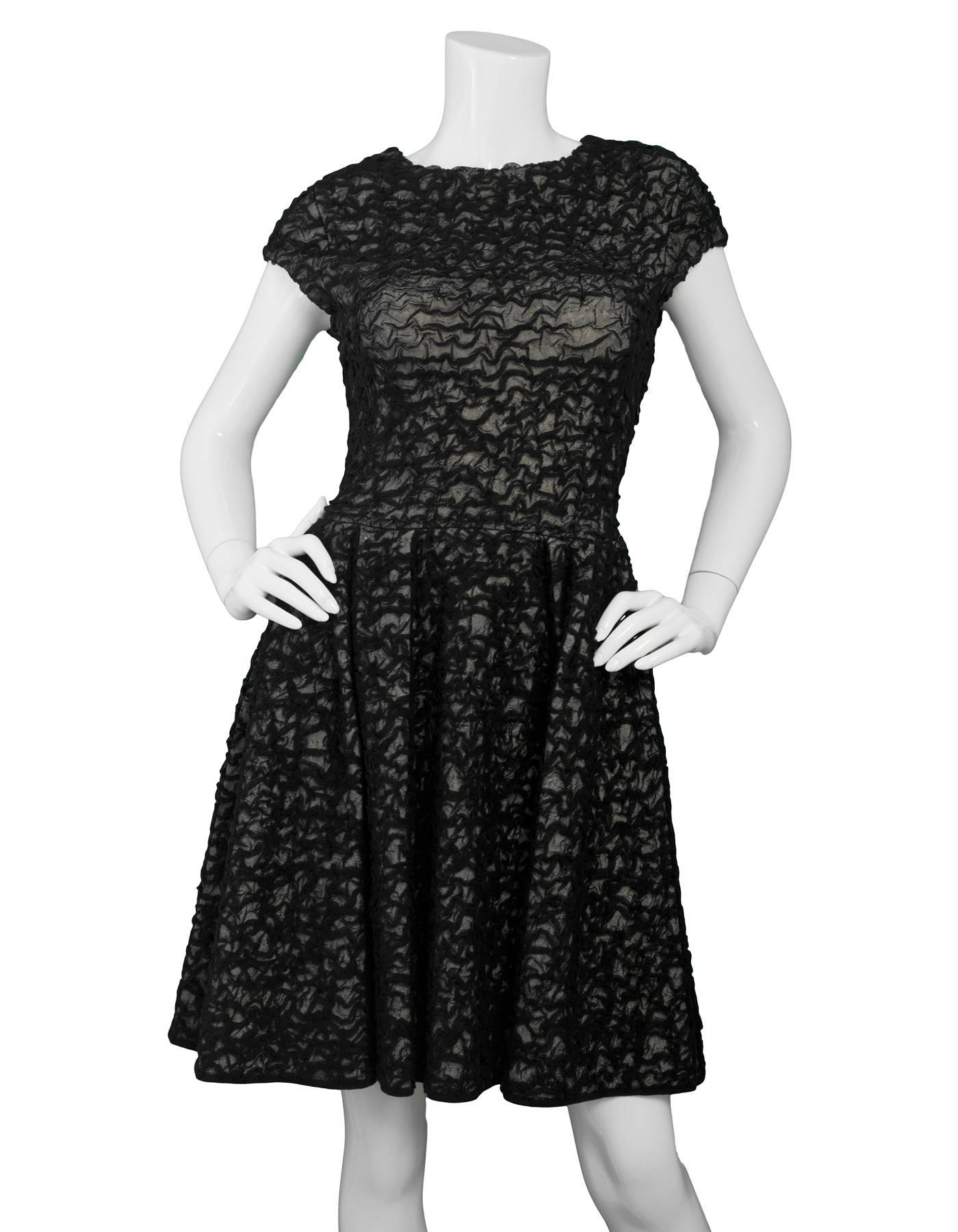 Christian Dior Black & White Textured Mesh Skater Dress

Made In: France
Color: Black and white
Composition: 60% viscose, 20% cotton, 18% polyamide, 2% elastane
Lining: None
Closure/Opening: Side zipper
Exterior Pockets: None
Interior Pockets: