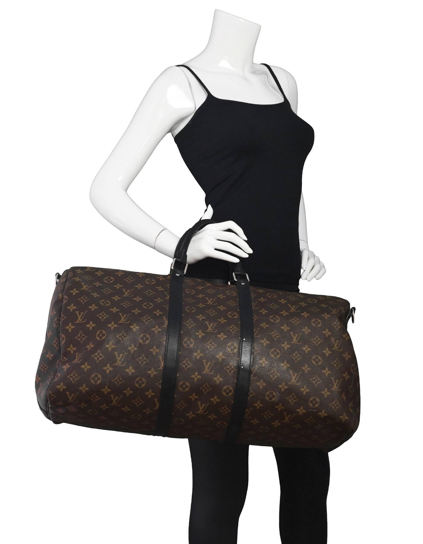 Louis Vuitton Monogram Macassar Keepall Bandouliere 55

Made In: France
Year of Production: 2012
Color: Brown and black
Hardware: Silvertone
Materials: Leather and coated canvas
Lining: Burgundy canvas
Closure/Opening: Double zip across top
Exterior