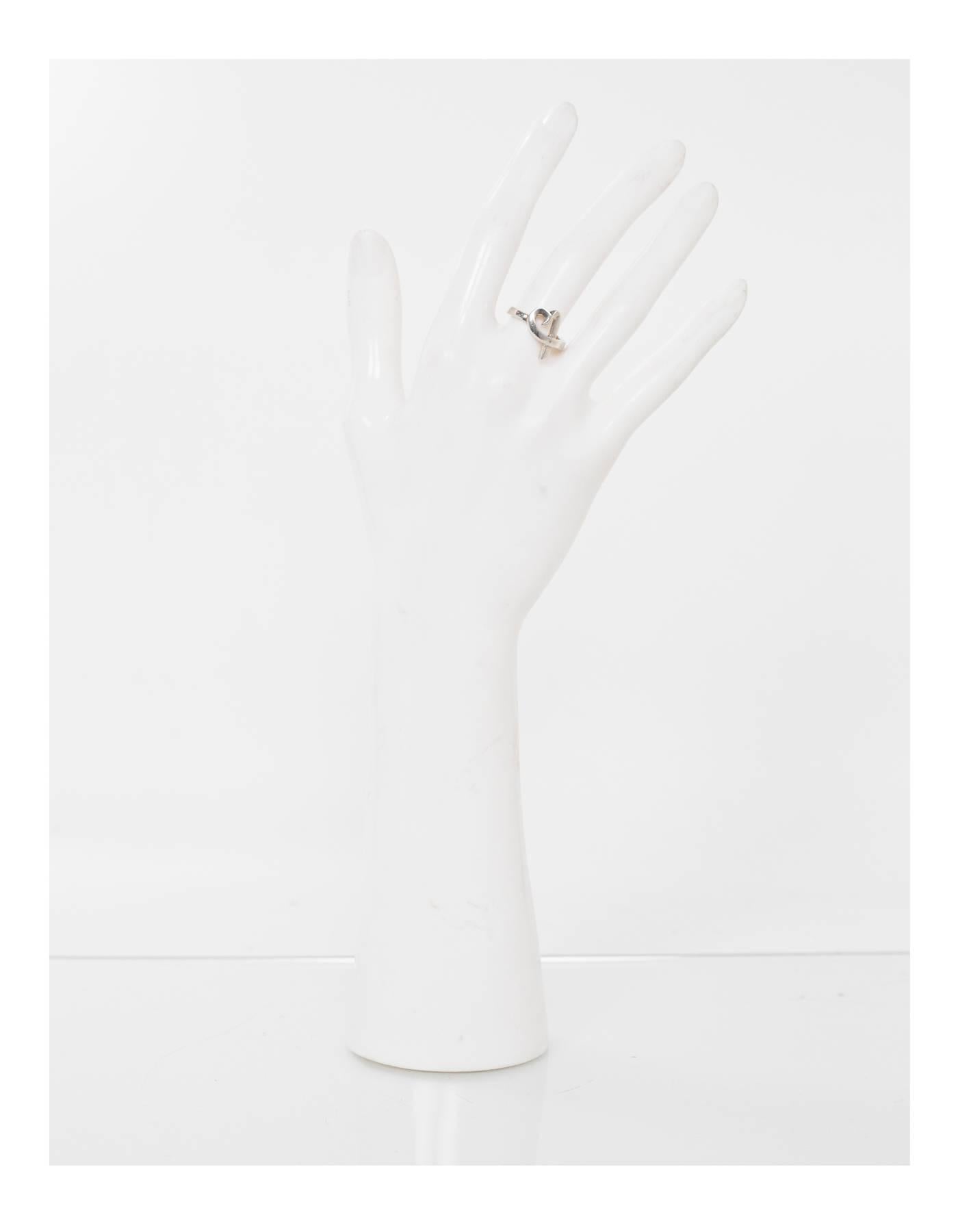 Tiffany & Co. Paloma Picasso Sterling Loving Heart Ring  Sz 5.5

Color: Silver
Materials: Sterling silver
Closure: None
Stamp: T & Co. 925
Overall Condition: Very good pre-owned condition with the exception of light surface marks and tarnish