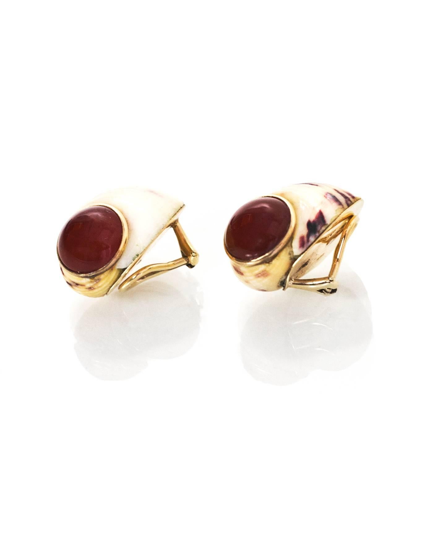 Maz 14k Gold & Carnelian Stone Snail Clip-On Earrings

Color: Ivory, brown
Materials: 14k Gold, carnelian stone
Closure: Clip-on
Stamp: Maz 14k
Overall Condition: Excellent pre-owned condition, minor surface marks
Measurements: 
Length: 1"
