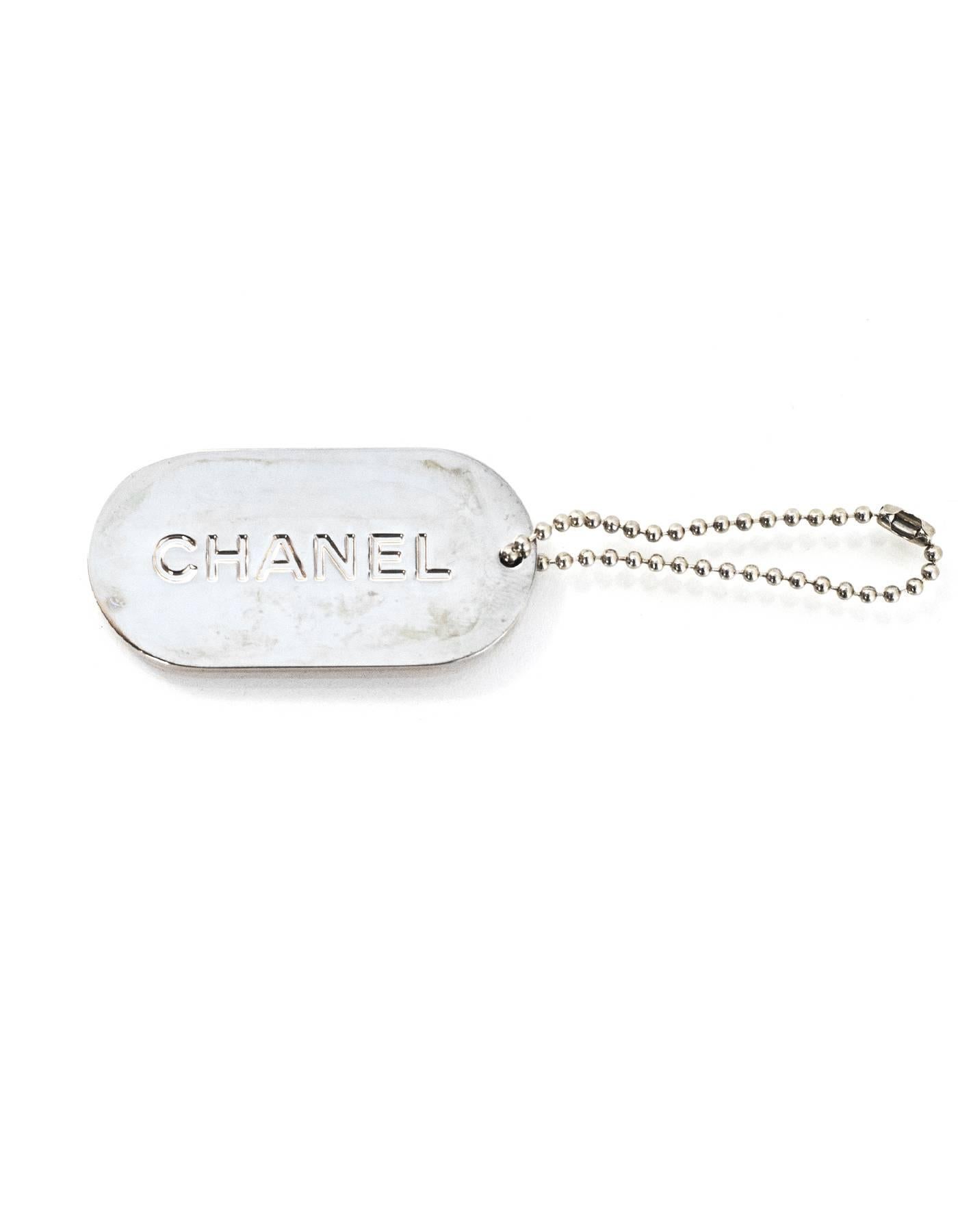 Chanel Peach & Gold Dog Tag Key Chain/Charm

Color: Peach, goldtone
Materials: Metal, enamel
Closure: Ball closure
Stamp: Chanel
Overall Condition: Excellent pre-owned condition

Measurements: 
Pendant: 2
