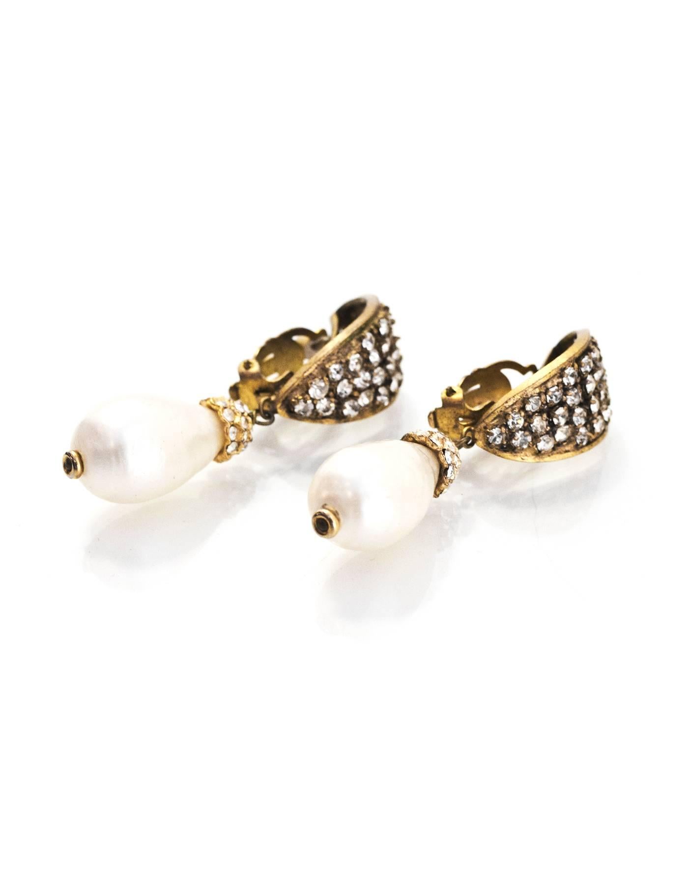Chanel Vintage Crystal and Pearl Drop Clip-On Earrings

Made In: France
Color: Gold, ivory
Materials: Metal, faux pearl, crystal
Closure: Clip on
Stamp: Chanel CC Made In France
Overall Condition: Excellent pre-owned vintage condition with the