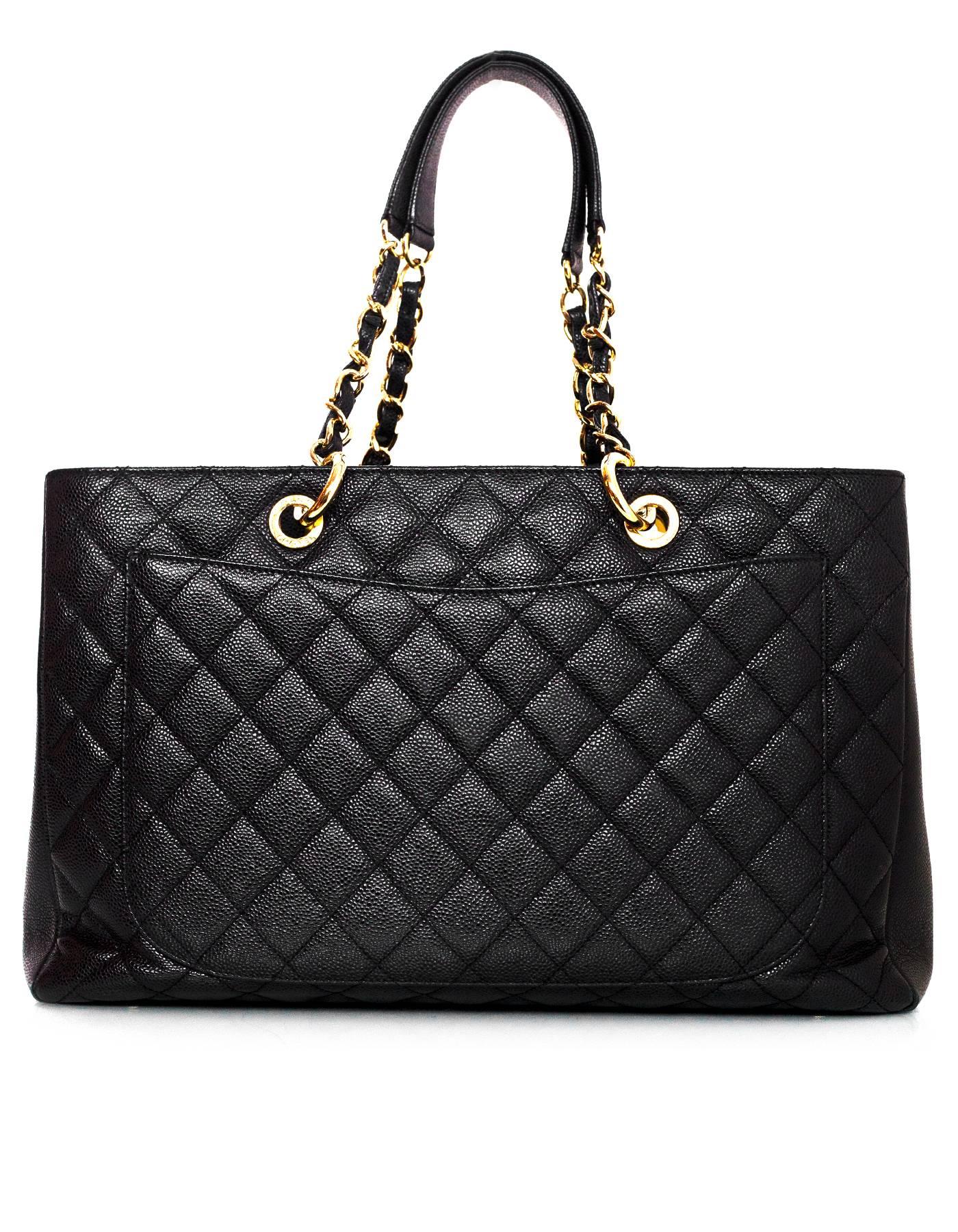 Chanel Black Caviar XL GST Grand Shopper Tote
Features timeless CC stitched on front of bag

Made In: Italy
Year of Production: 2012
Color: Black
Hardware: Goldtone
Materials: Caviar leather
Lining: Black satin
Closure/Opening: Open top
Exterior