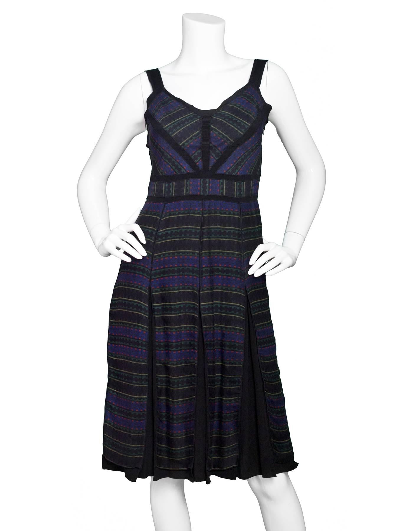 Proenza Schouler Tribal Print Silk Pleated Dress

Color: Black, blue, red, green and yellow
Composition: Not given- believed to be 100% silk
Lining: Black, Silk
Closure/Opening: Side zip up
Exterior Pockets: None
Interior Pockets: None
Overall