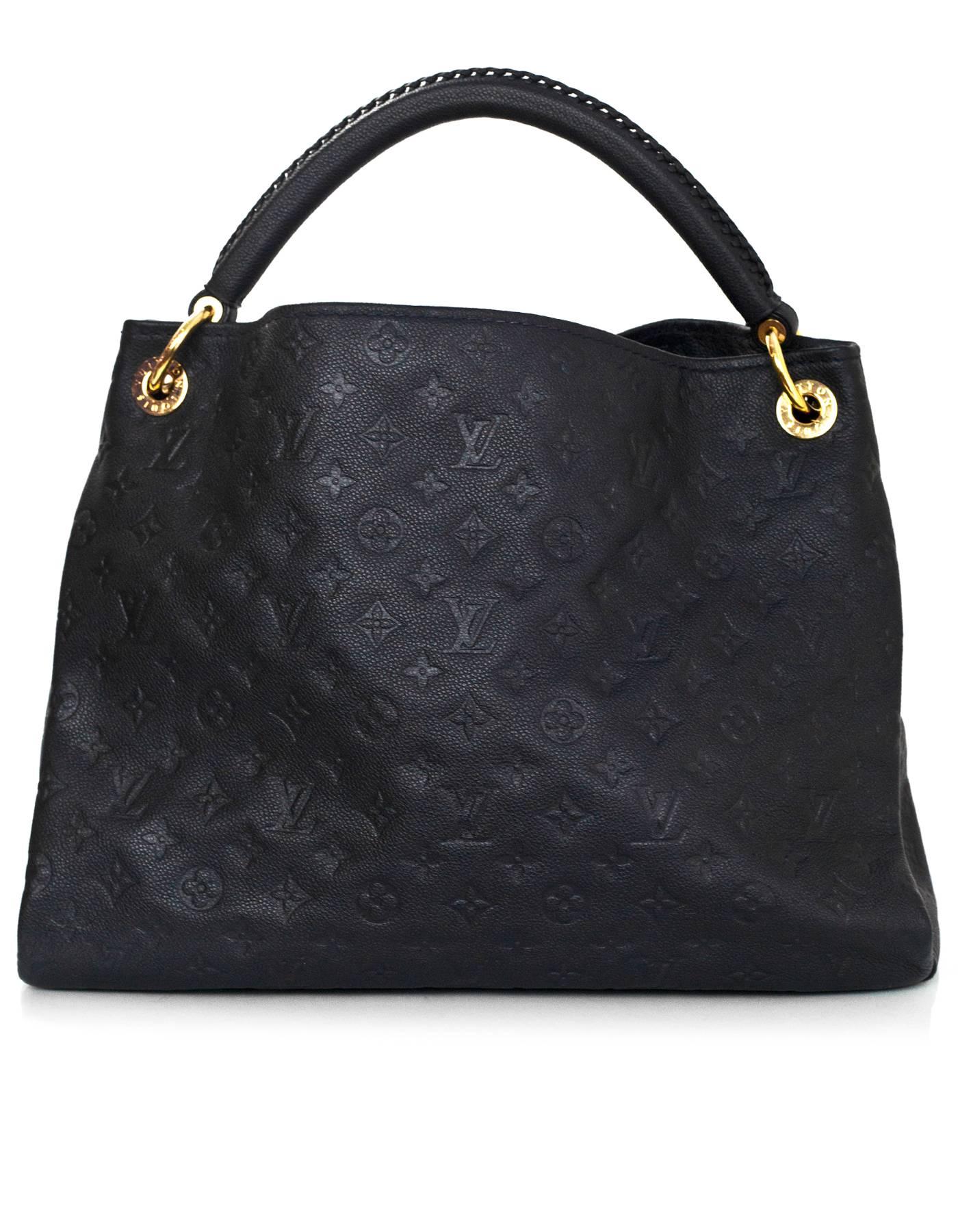 Louis Vuitton Blue Infini Monogram Empreinte Artsy MM

Made In: Spain
Year of Production: 2011
Color: Blue infini- dark navy
Hardware: Goldtone
Materials: Leather, metal
Lining: Blue and black textile
Closure/Opening: Open top
Exterior Pockets: