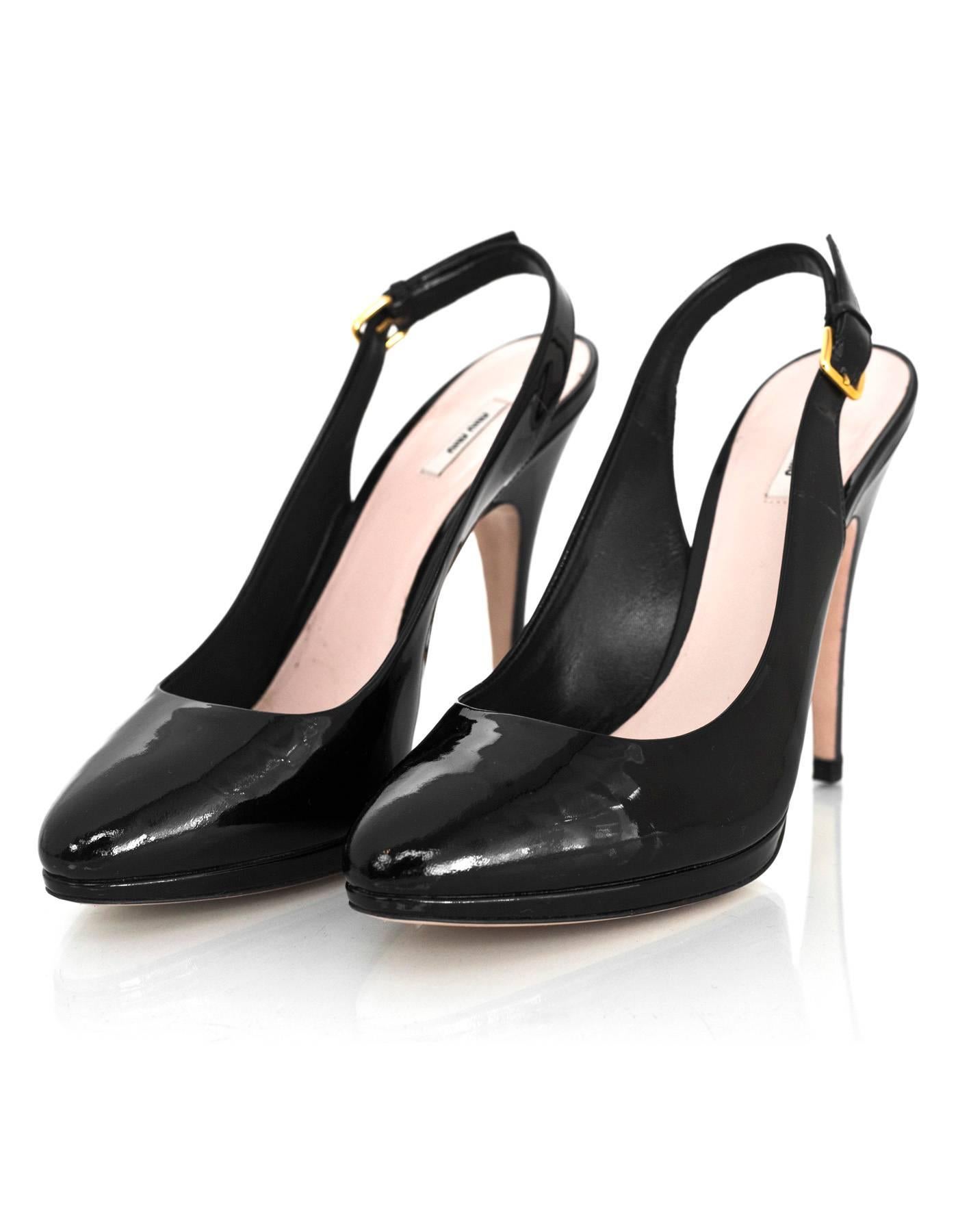 Miu Miu Black Patent Leather Sling Back Pumps

Made In: Italy
Color: Black
Materials: Patent leather
Closure/Opening: Sling back with buckle
Sole Stamp: Miu Miu Made in Italy 37 1/2
Overall Condition: Excellent pre-owned condition with the exception