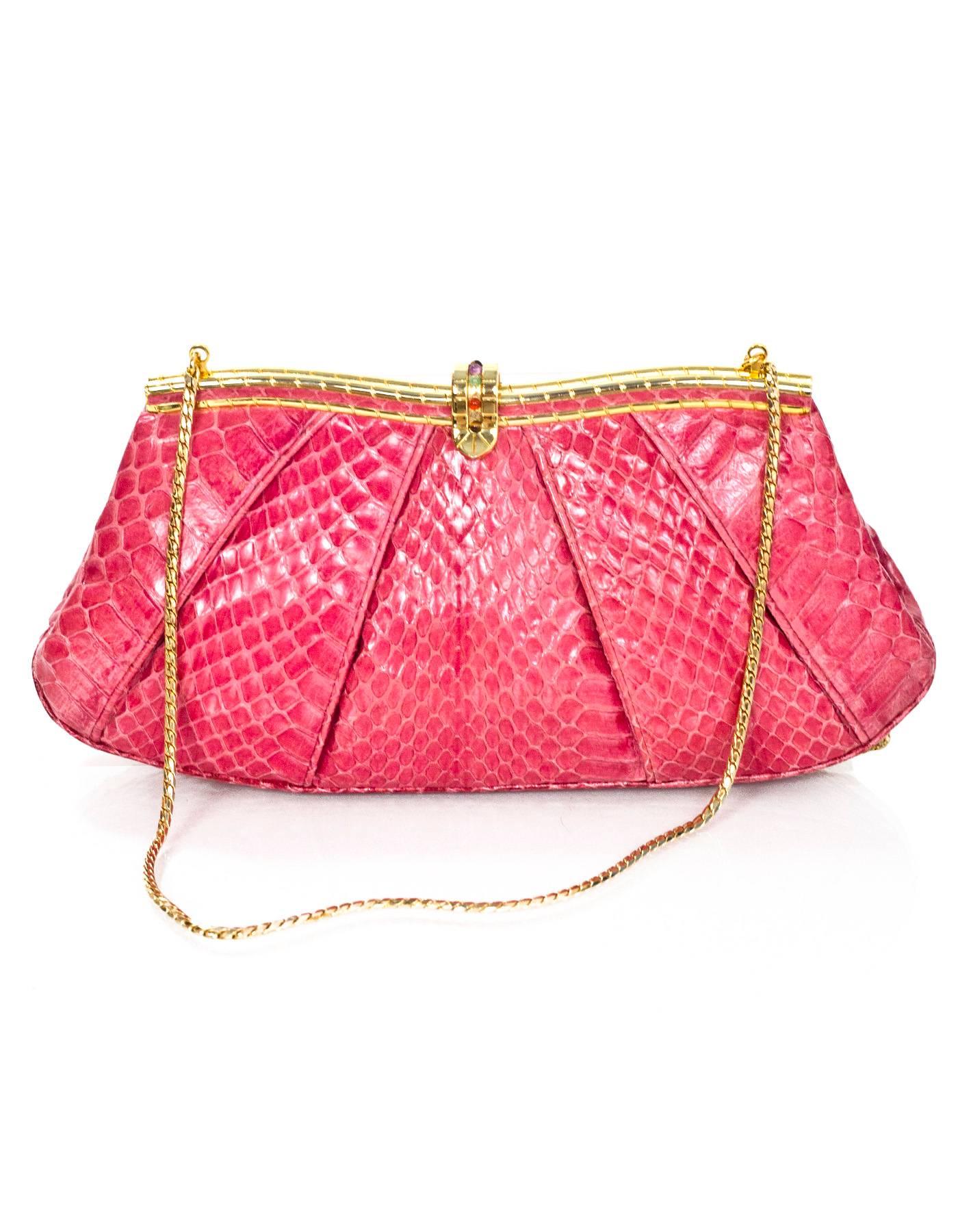 Judith Leiber Pink Python Evening Bag
Features different colored stones at clasp closure and optional chain link shoulder strap

Color: Pink 
Hardware: Goldtone
Materials: Python, metal and stones
Lining: Pink satin
Closure/Opening: Frame bag-style