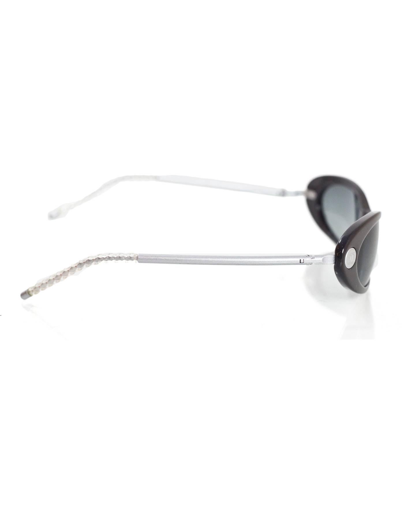 Chanel Vintage Grey Cat Eye Sunglasses 
Features silver CC's on either side of lenses

Made In: Italy
Color: Silver and charcoal
Materials: Metal and resin
Stamp: C1187734
Overall Condition: Excellent pre-owned condition with the exception of one