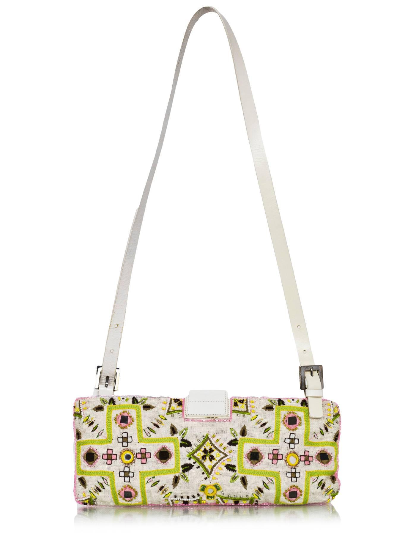 Fendi White & Green Beaded Baguette
Features fringe trim

Made In: Italy
Color: White, green, pink
Hardware: Silvertone
Materials: Cotton, beads, leather
Lining: Yellow nylon-blend textile
Closure/Opening: Zip top with center flap FF