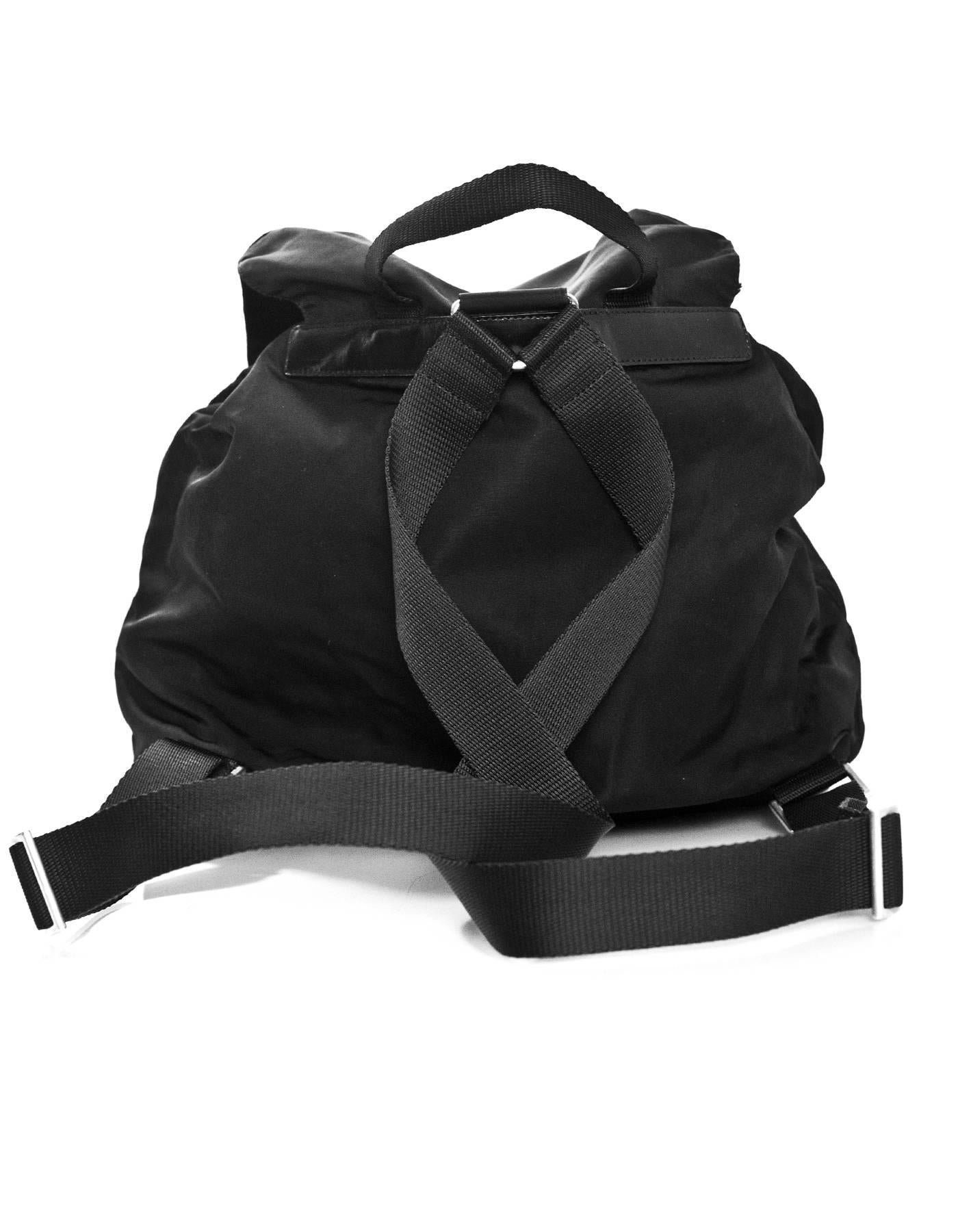 Prada Black Tessuto & Leather Trim Backpack

Made In: Italy
Color: Black
Hardware: Silver
Materials: Tessuto nylon, leather, metal
Lining: Black textile
Closure/Opening: Drawstring with flap top and buckle closure
Exterior Pockets: Two front