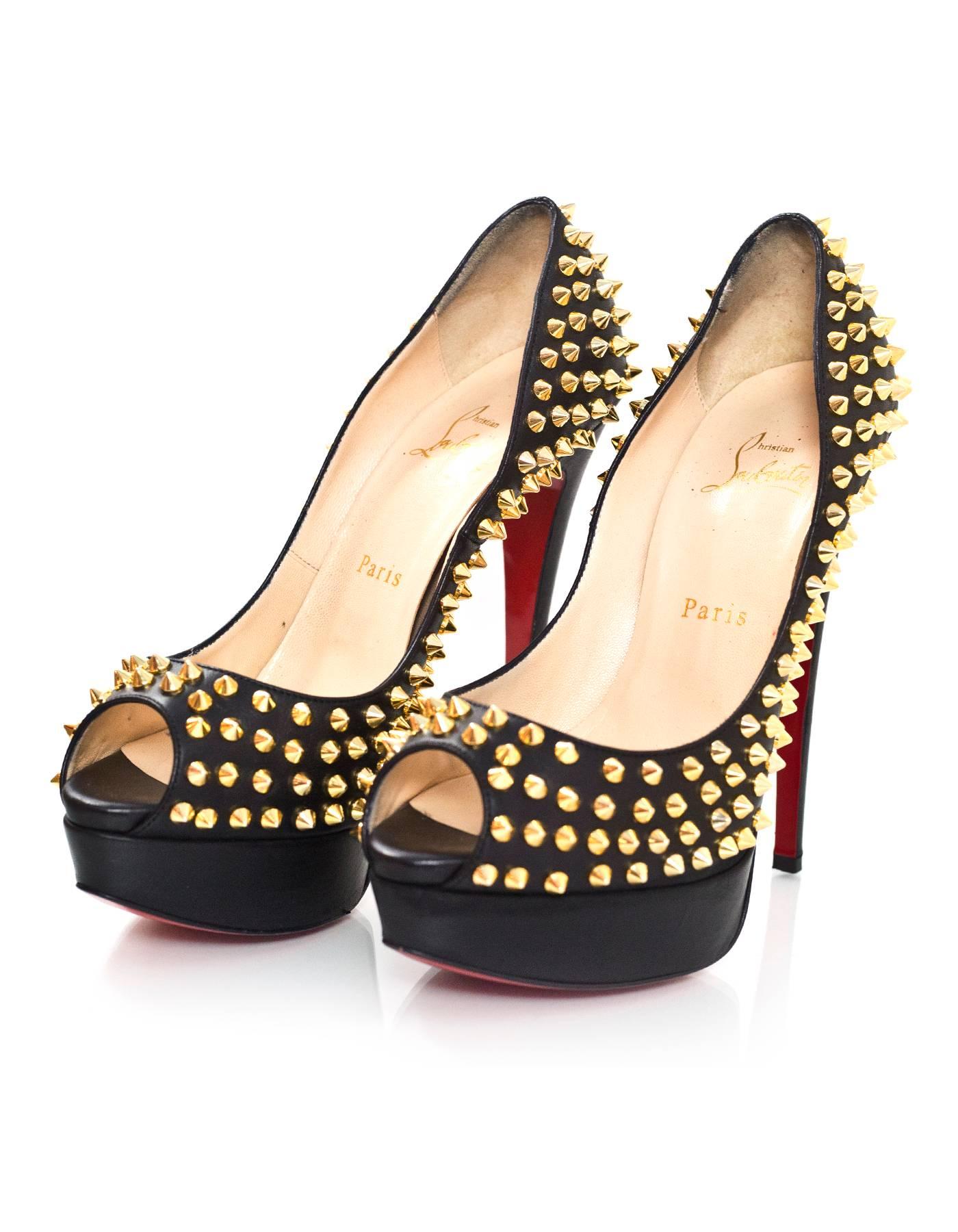 Christian Louboutin Black & Gold Lady Peep Spikes 150 Pumps Sz 38.5

Made In: Italy
Color: Black, gold
Materials: Leather, metal
Closure/Opening: Slide on
Sole Stamp: Christian Louboutin Made in Italy 38.5
Retail Price: $1,395 + tax
Overall