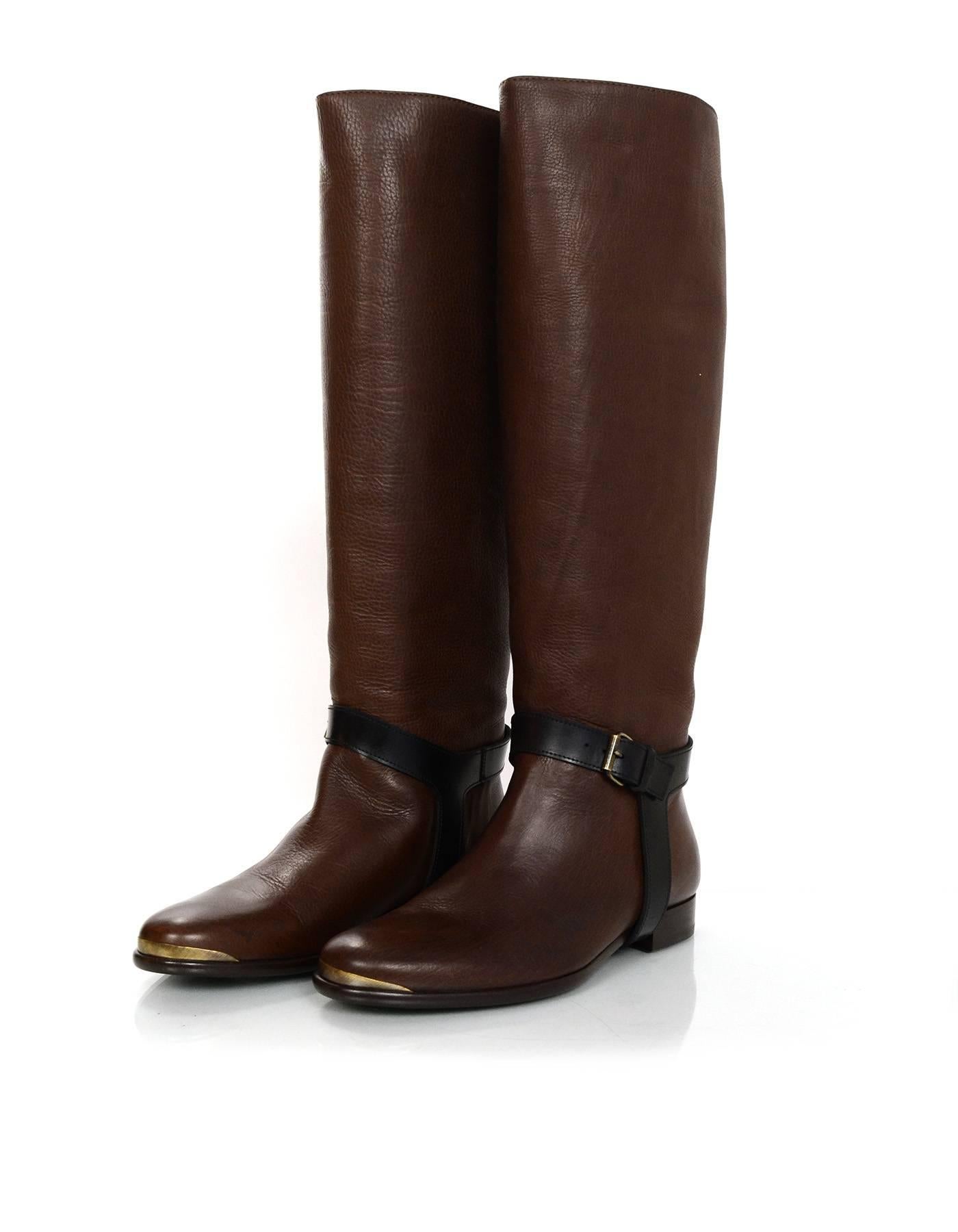 Lanvin Brown Riding Boots Sz 37 NIB
Features black stirrups

Made In: Italy
Color: Brown, black
Materials: Leather
Closure/Opening: Pull-on
Sole Stamp: Lanvin 37 made in italy
Overall Condition: Excellent pre-owned - no signs of wear
Included: