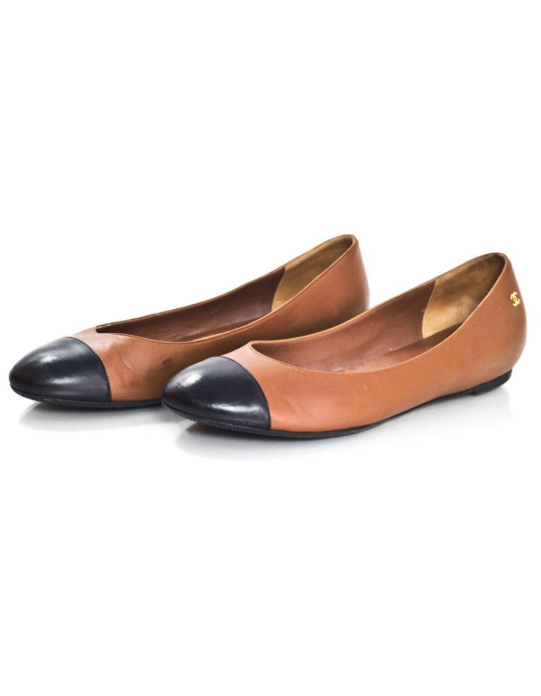 tan and black cap toe flats